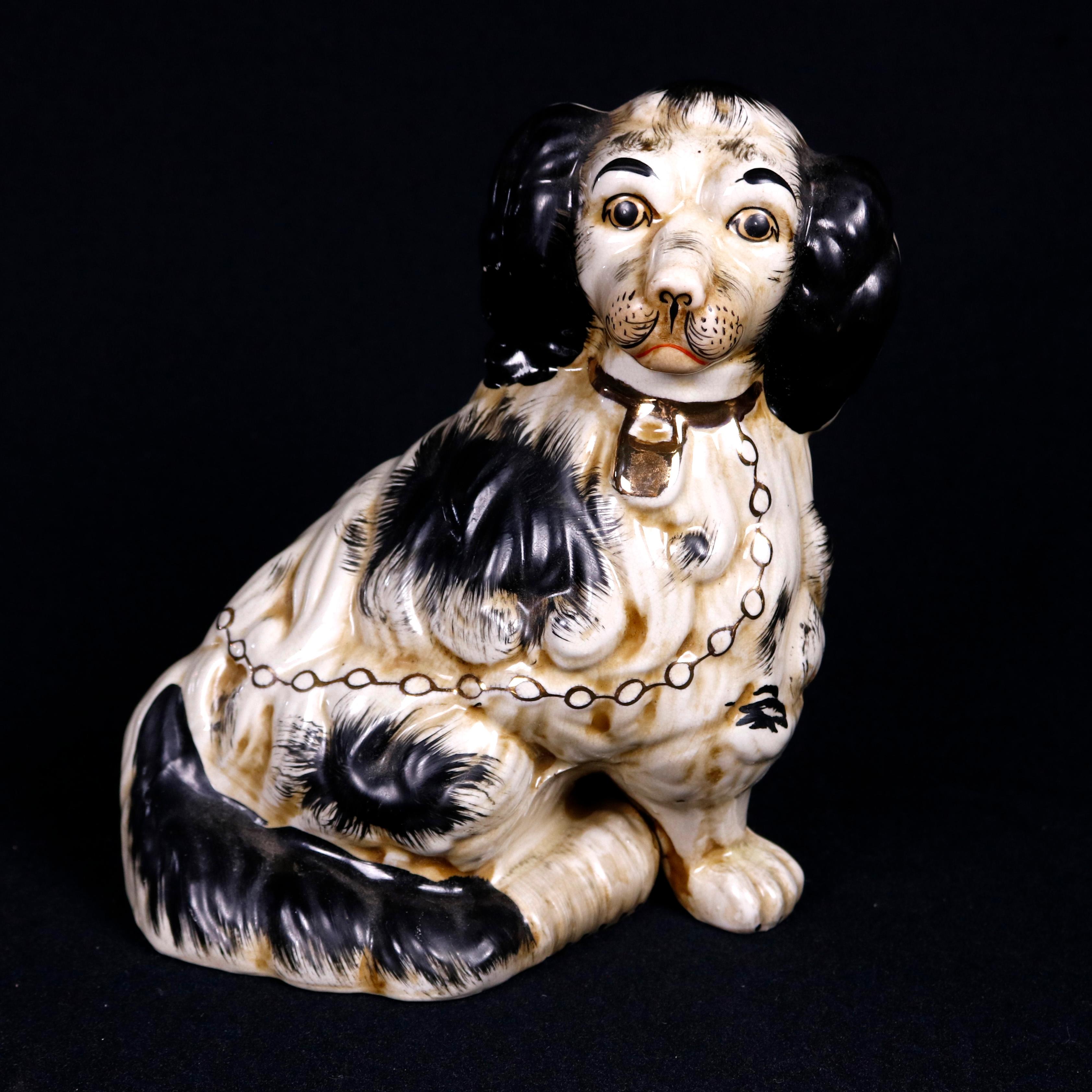 A pair of English figural Staffordshire pottery dogs offer spaniel form with black and white coloring, 20th century

***DELIVERY NOTICE – Due to COVID-19 we are employing NO-CONTACT PRACTICES in the transfer of purchased items.  Additionally, for