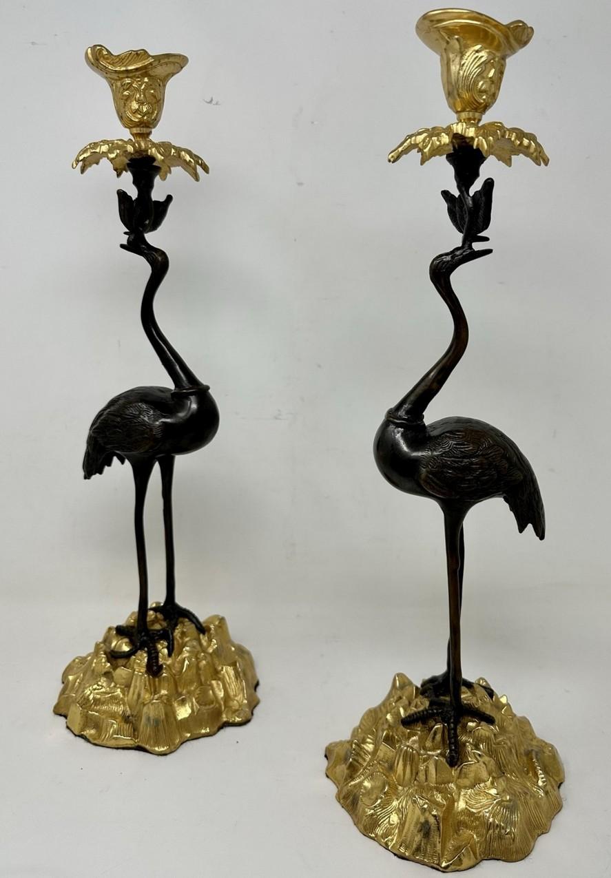 Stunning Pair of English Ormolu and Patinated Bronze Single Light Candlesticks  of good size proportions modelled as a Pair of Storks, firmly attributed to ABBOTT. Circa 1840-60. 

Each exquisitely modelled as standing Storks or Cranes perched on a