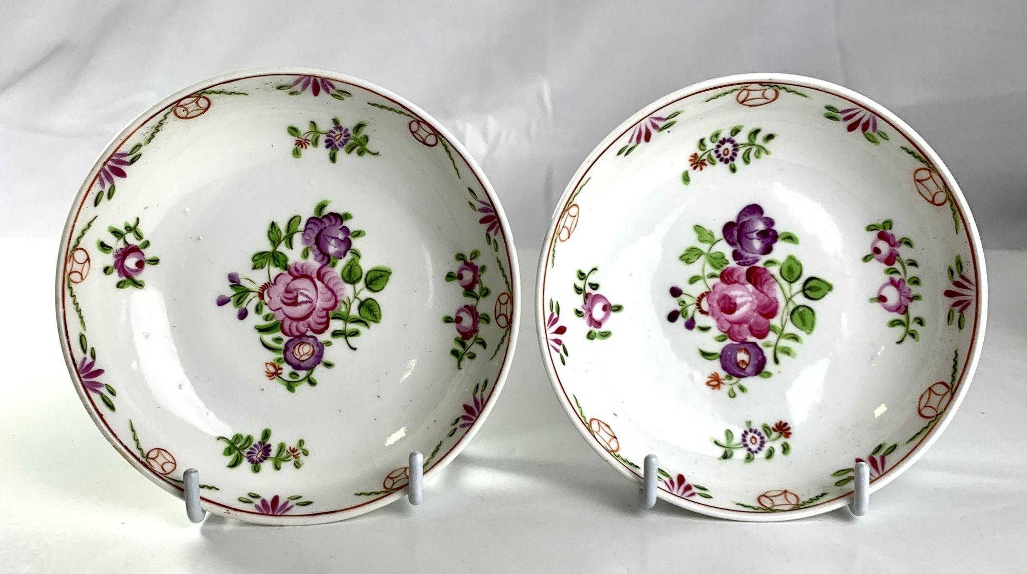 These charming, simple, colorful porcelain saucers are decorated with pretty roses. 
The pair was made in England circa 1810.
The saucers are a lovely pop of color.
Their symbolic meaning is quite remarkable.
Traditionally the deep pink roses convey