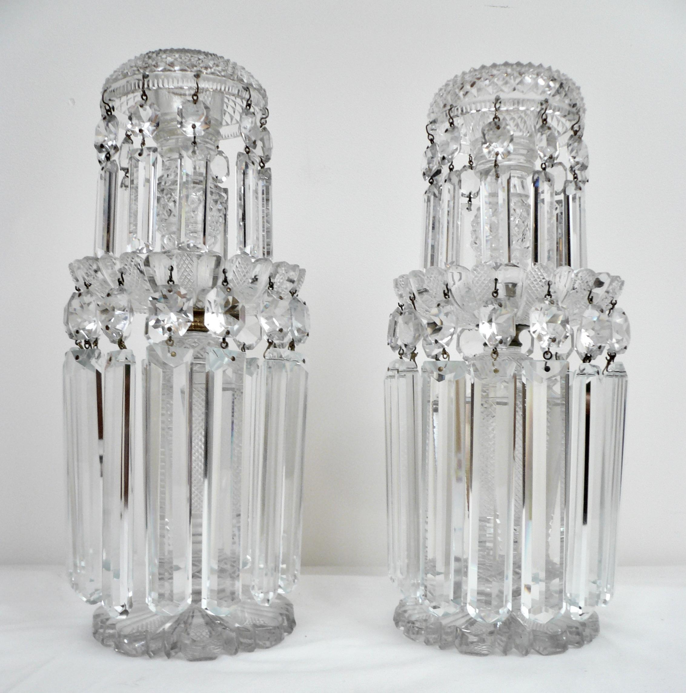 This fine pair of English Regency two tiered candlesticks, or lustres feature lapidary, 