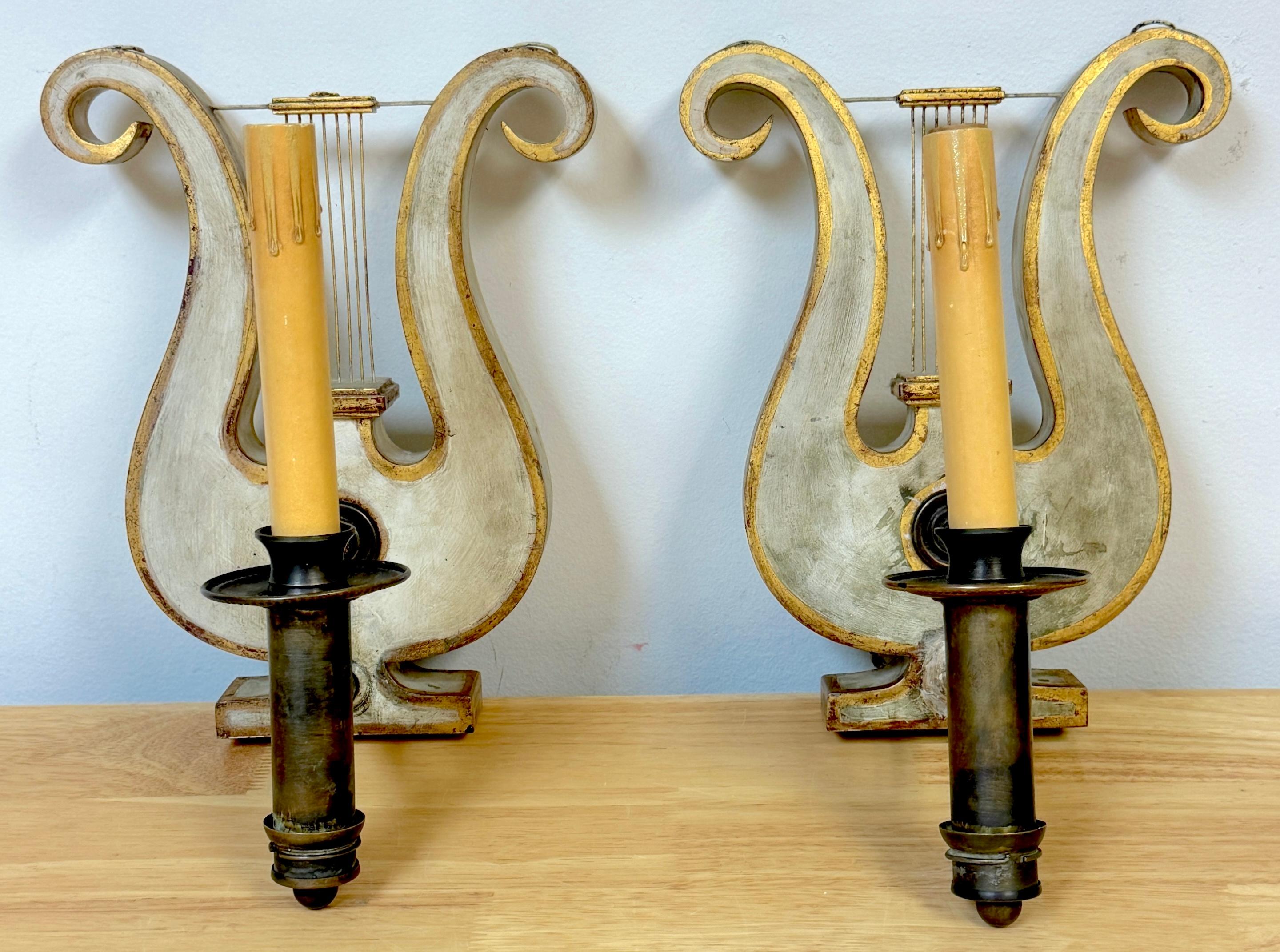 Pair English Regency Gray Painted Tole & Brass Lyre Motif Wall Sconces 
England, circa 1830s, originally fitted for oil, now electrified.

A pair of exquisite English Regency Gray Painted Tole and Brass Lyre Motif Wall Sconces dating back to the