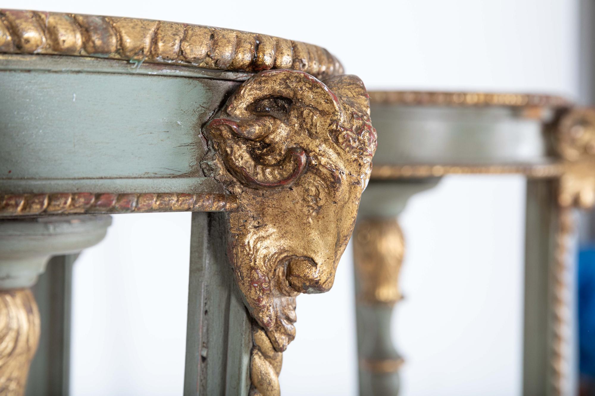 Circa 1810

Pair Tall English Regency Rams Head Parcel-Gilt Carved Torcheres- Display Stands

A pair of 19th Century tall triform torcheres having circular table tops with gilt painted rams heads, twisted decoration to the sides united by a finial