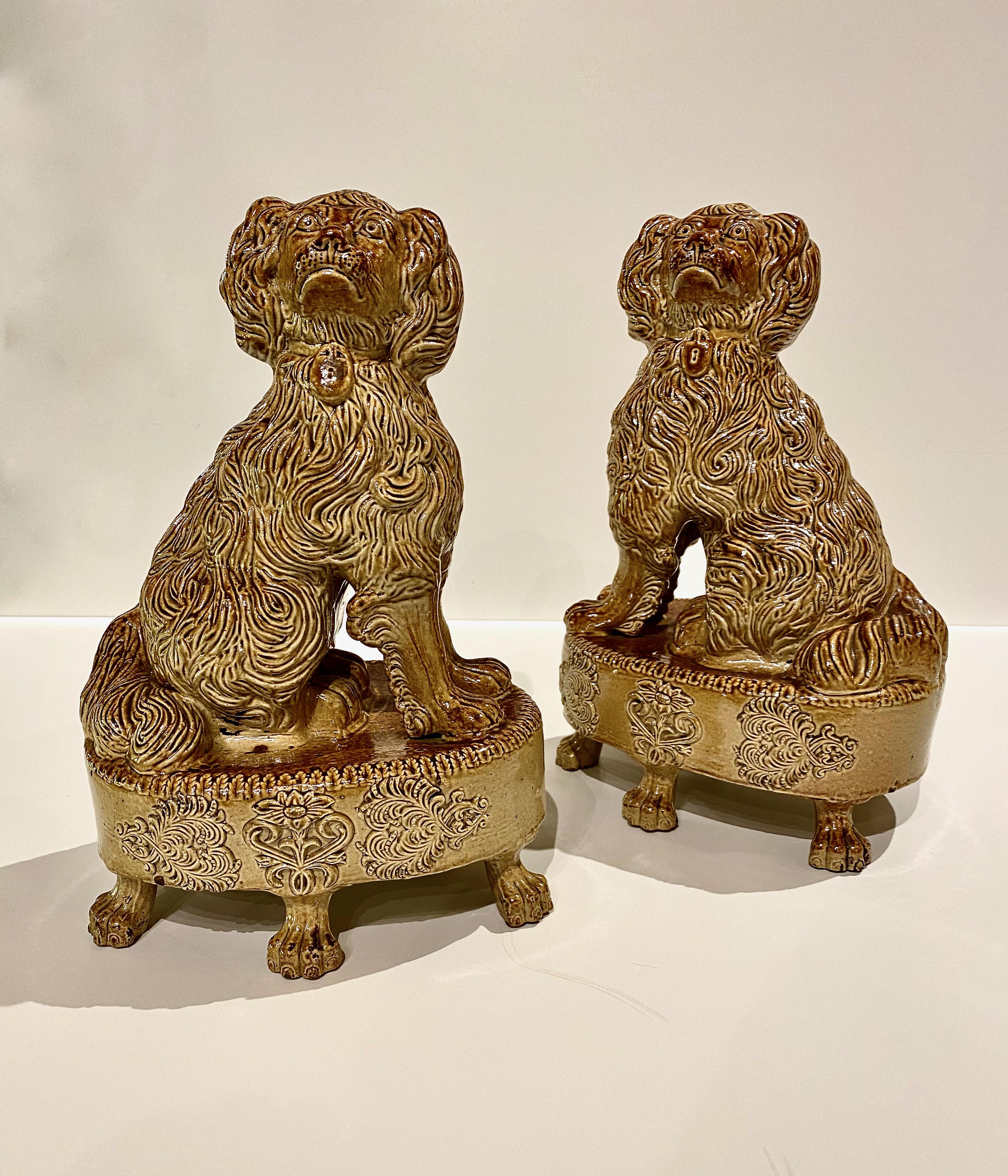 This is an imposing pair of stoneware saltglaze spaniels that were made at the Briddon Pottery in Brampton Derbyshire circa 1830. They are a unique design and historically significant as they are probably the inspiration for figures that were later