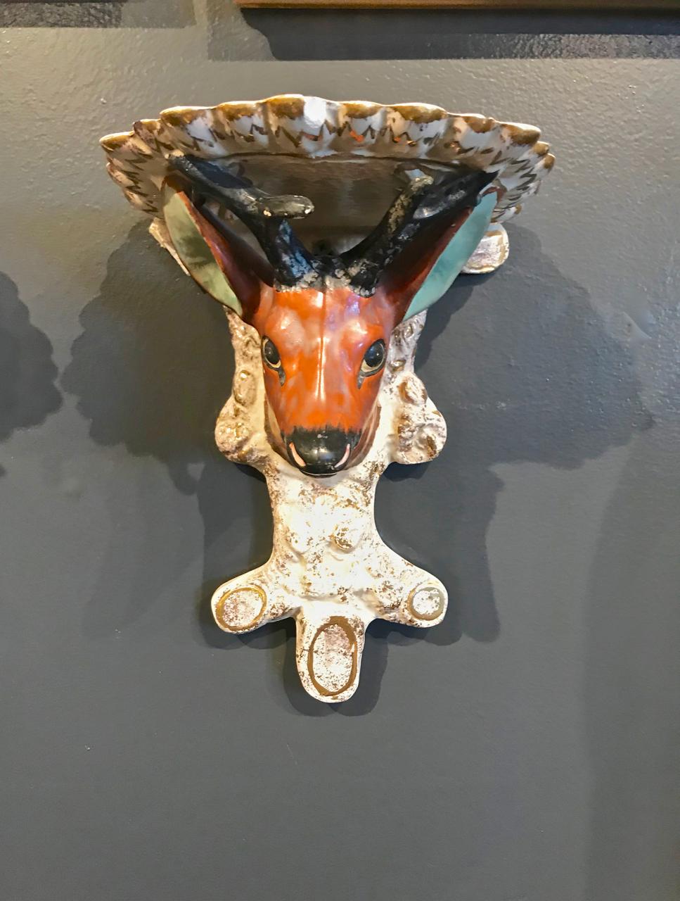 This is an unusual pair of mid-19th century Staffordshire brackets or sconces in the form of deer heads. Both brackets are in overall very good condition with the anticipated normal patination and very minor losses to enameling.