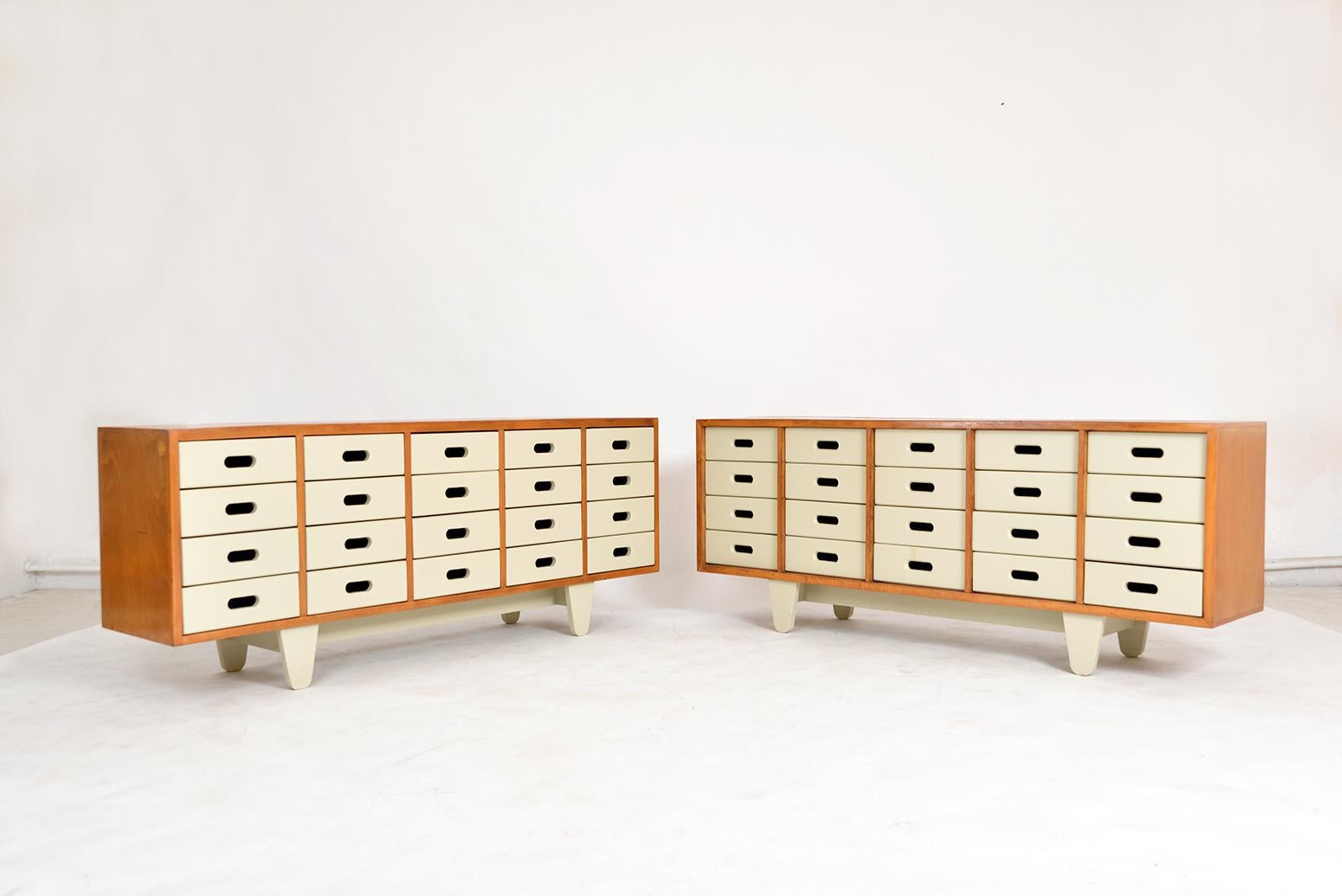 A near pair of drawer units designed by James Leonard for Esavian ESA (Educational Supply Association), a leading UK supplier of school furniture. These are the rarely seen 5 x 4 multi-drawer arrangement, as apposed to the most common 4 x 5. 
In