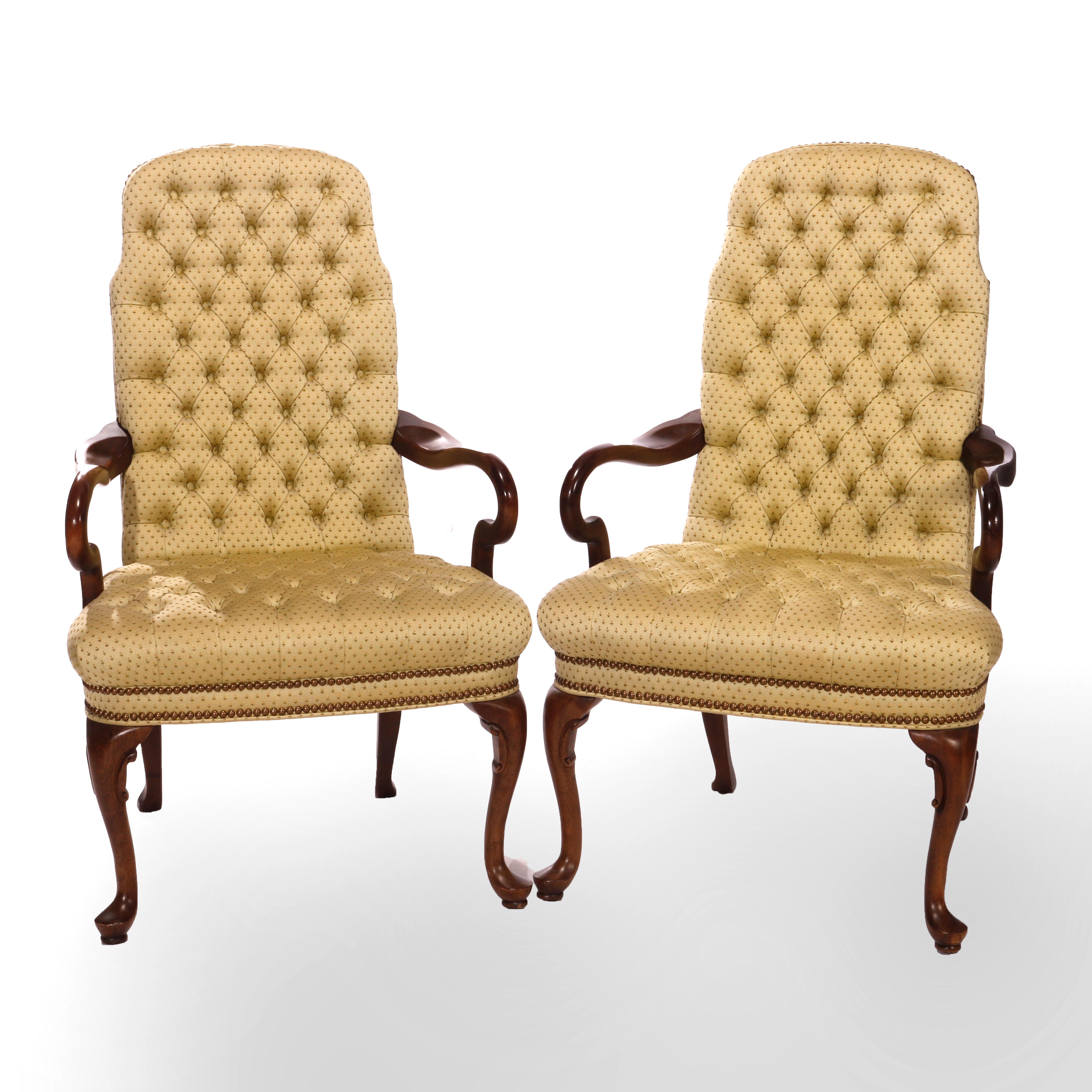 A pair of Queen Anne style arm chairs by Ethan Allen offers shaped tall back with tufted upholstered button backs and seats with walnut arms and cabriole legs terminating in pad feet, maker label as photographed, 20th century

Measures - 43'' H x