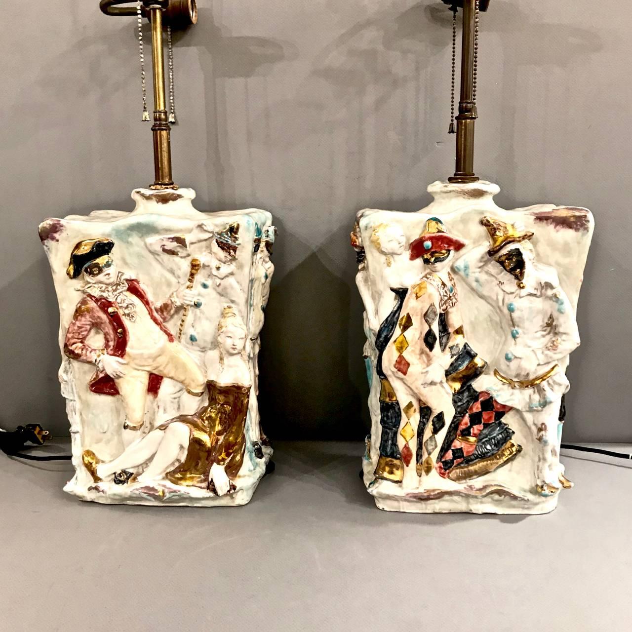 This is a superb set of midcentury Italian ceramic lamps by the renown Prof. Eugenio Pattarino that date to the mid-20th century. The lamps feature high relief Carnival Reveller figures in festive glazed colors.
Eugenia Pattarino (1885-1971) was a