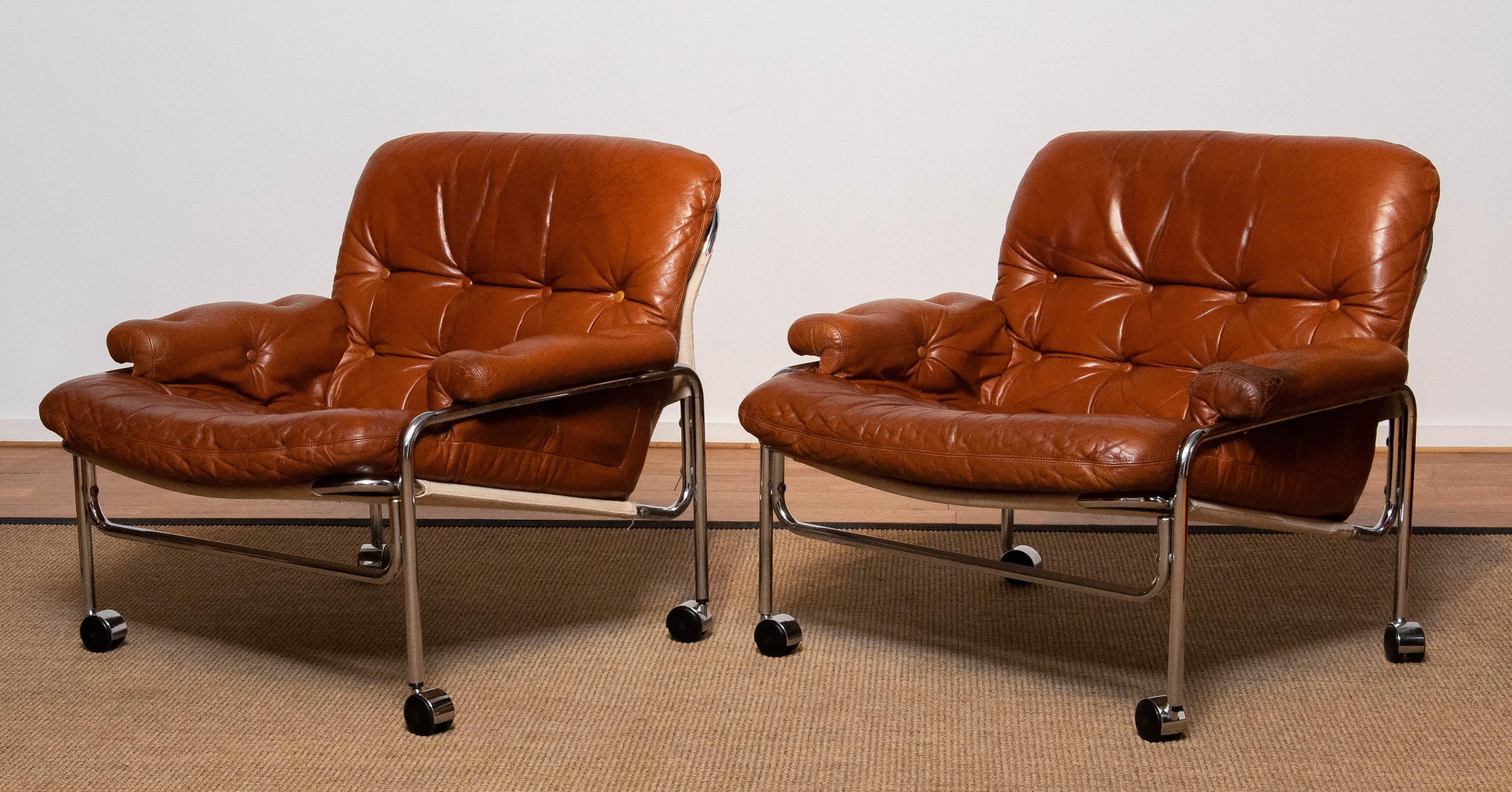 Mid-Century Modern Pair 'Eva' Lounge Chairs Chrome and Aged Brown / Tan Leather by Lindlöfs Möbler