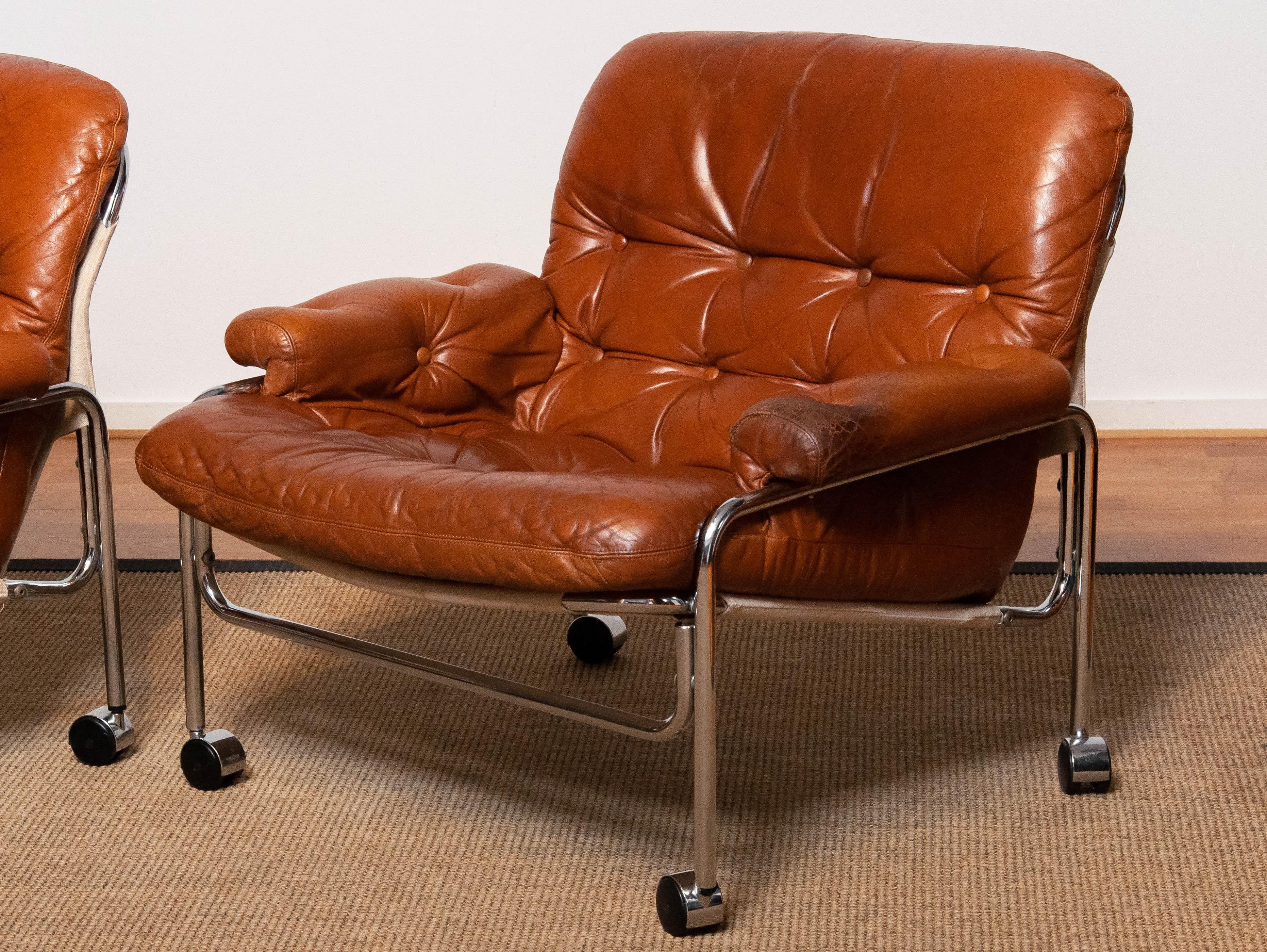 Swedish Pair 'Eva' Lounge Chairs Chrome and Aged Brown / Tan Leather by Lindlöfs Möbler