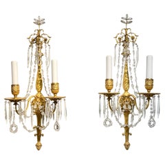 Paire d'exceptionnelles appliques à deux lumières en bronze doré de style Louis XVI