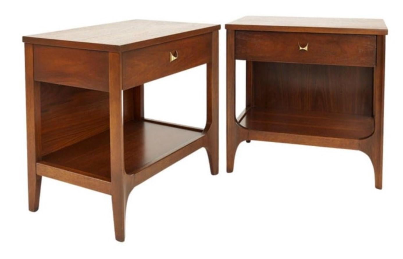 This fantastic pair of nightstands or end tables was built in the 1970s by high-end manufacturer Broyhill for their Brasilia line of furntiure. Since then, the Brasilia line has become more desirable, and original sets are difficult to come by.