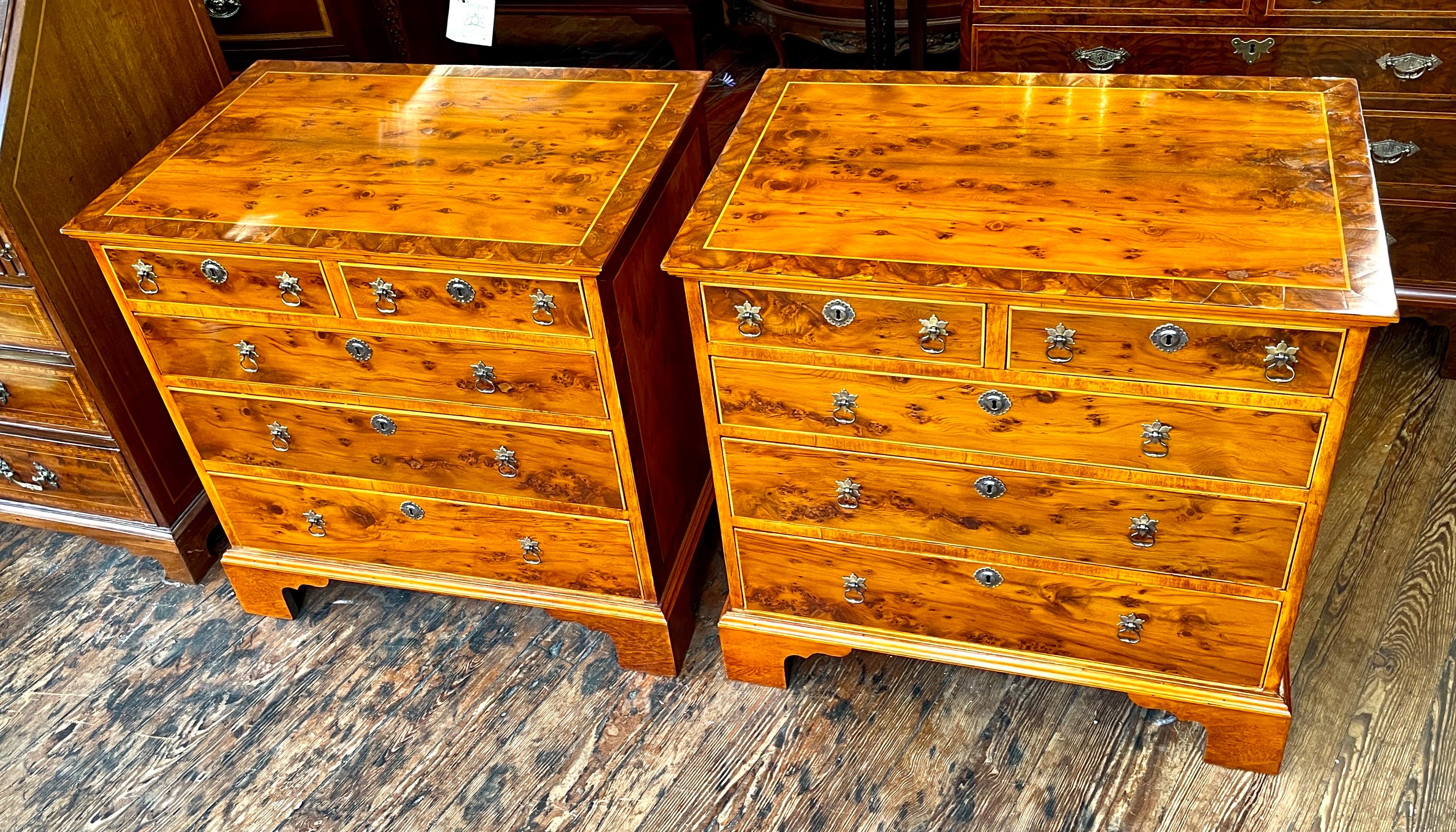 This extraordianry PAIR of Antique English inlaid and crossbanded Yew wood Bachelor's Chests were made during the Queen Anne Revival period of the mid-19th century in England (Circa 1850-'75).  (The originals would have been made in the early 18th