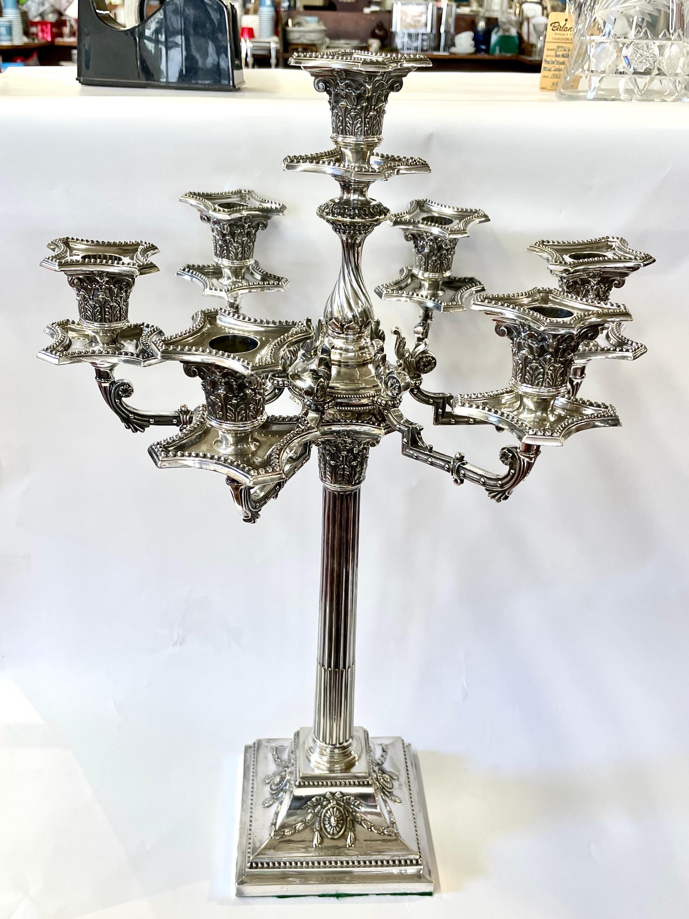 This is a PAIR of quite possibly the Finest Antique English Sheffield Silver plated Adam style Candelabra we have ever had in our over 100 years of being in business. Not only are they seven-light and palatial in size (at nearly two feet tall and