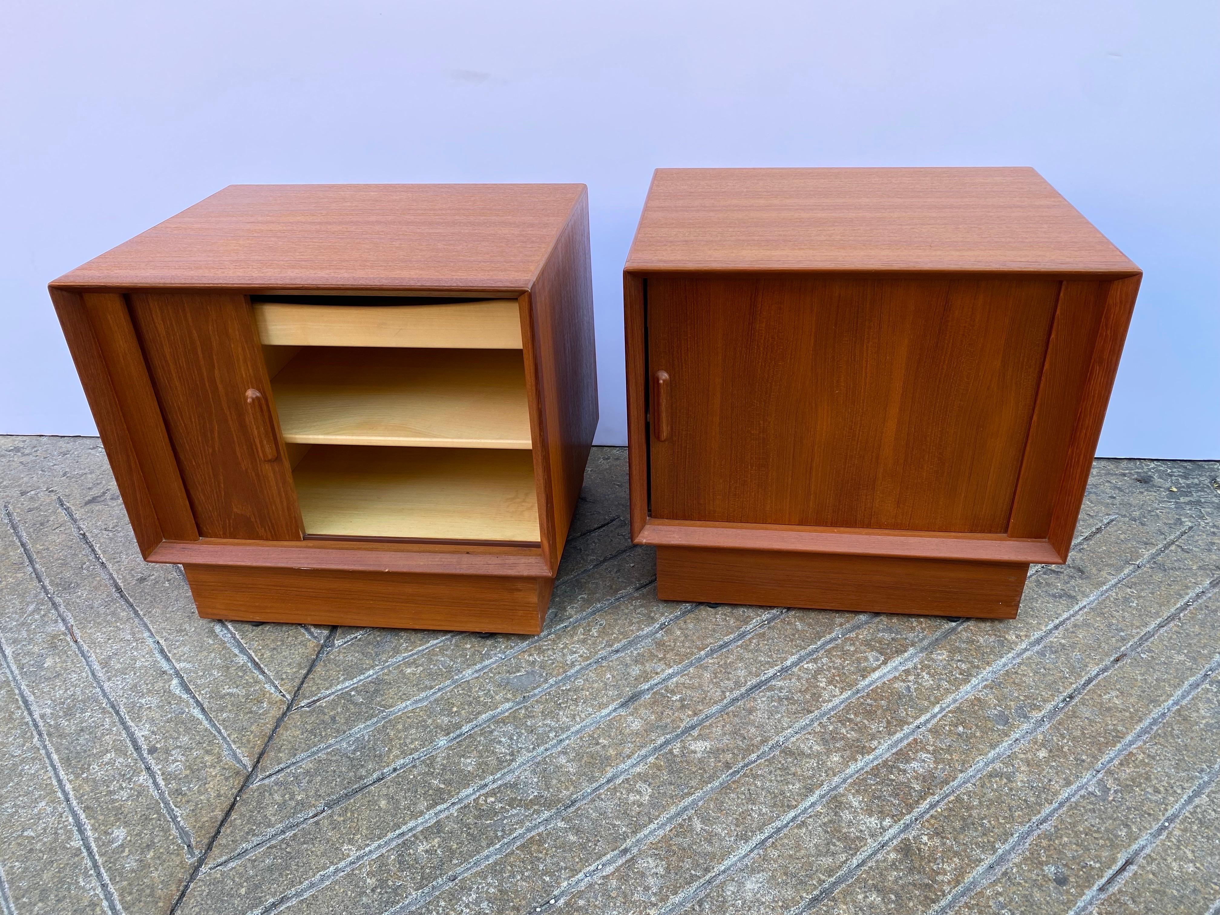 Nice pair of Falster teak Tambour door nightstands with Birch pull out drawer and interior. Very nice shape, tops refinished, all cleaned and oiled. Label inside one cabinet. Nice scale and size! Measure 17.25 deep, 21.75 wide and 20