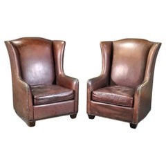Paire de fauteuils à haut dossier en cuir imprimé faux alligator de style Art déco