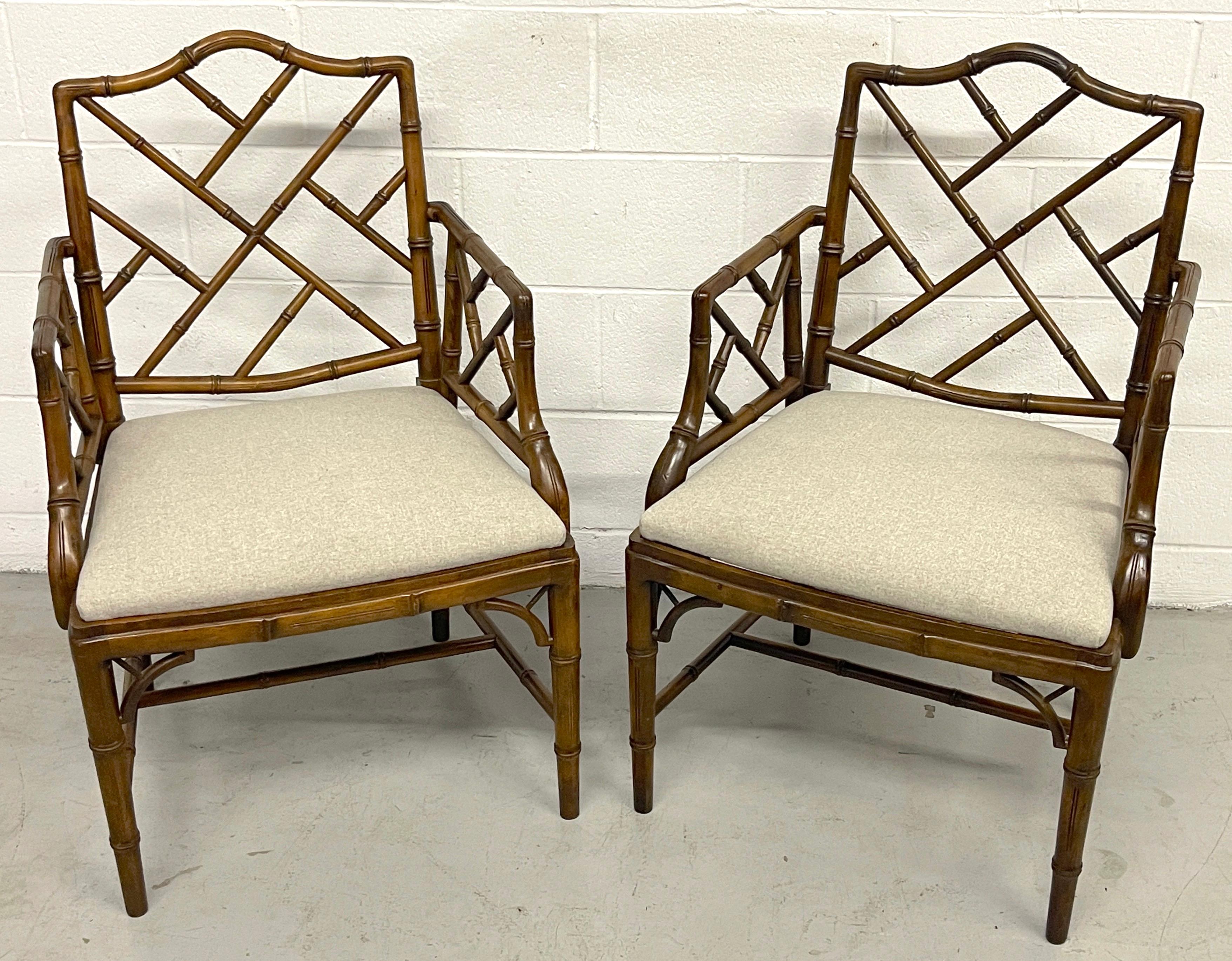 Pair Faux Bamboo Chinese Chippendale Style Armchairs with Cashmere Blend Seats
England, Circa later 20th Century 

An exquisite pair of carved mahogany faux bois arm chairs in the Chinese Chippendale taste. finely carved and modled, better than