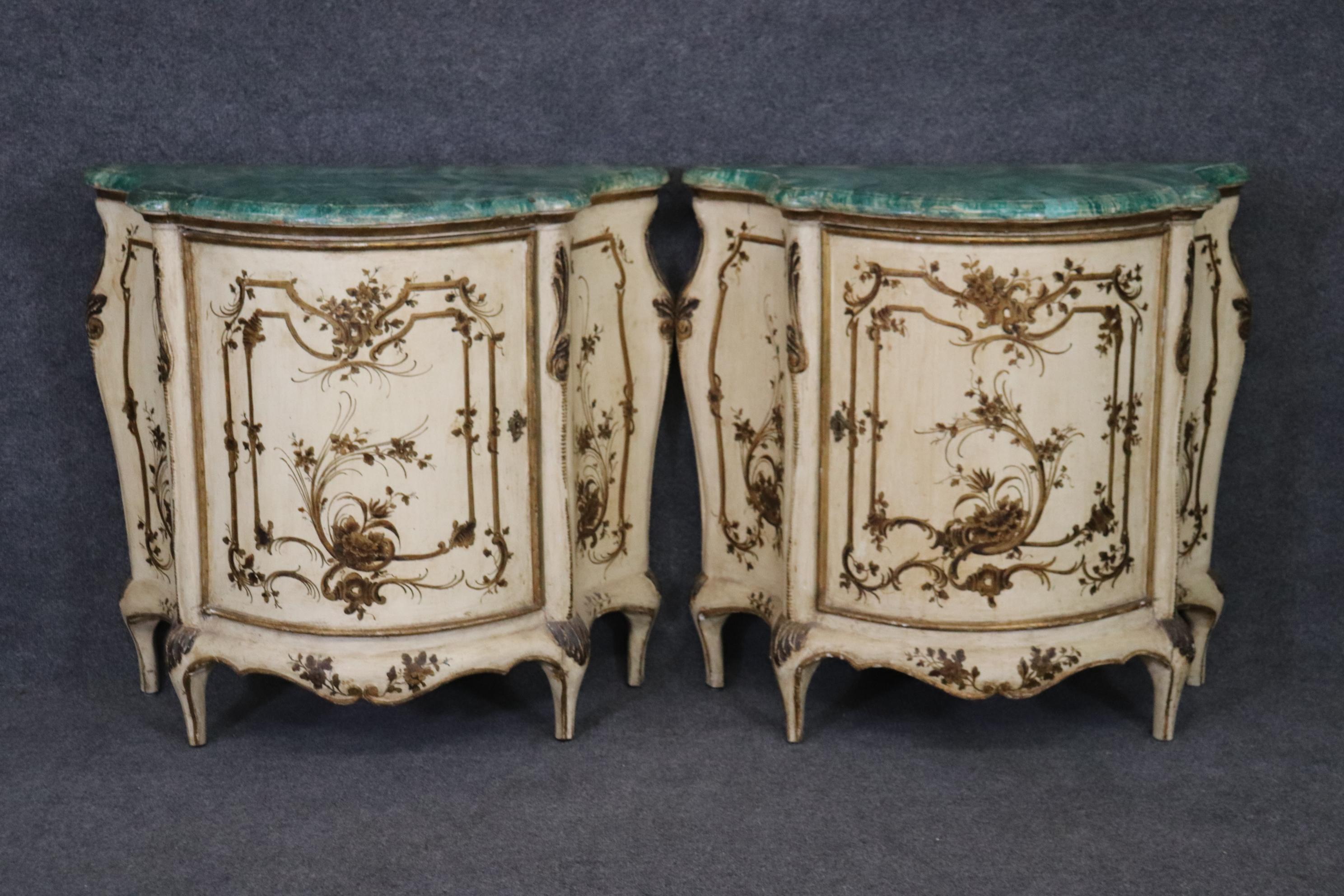 This is a very rare and beautifully painted pair of faux malachite nightstands in the Venetian taste and from Italy and labeled from Italy. The stands are expertly painted in a faux malachite finish with a cream finish and additional decoration. The
