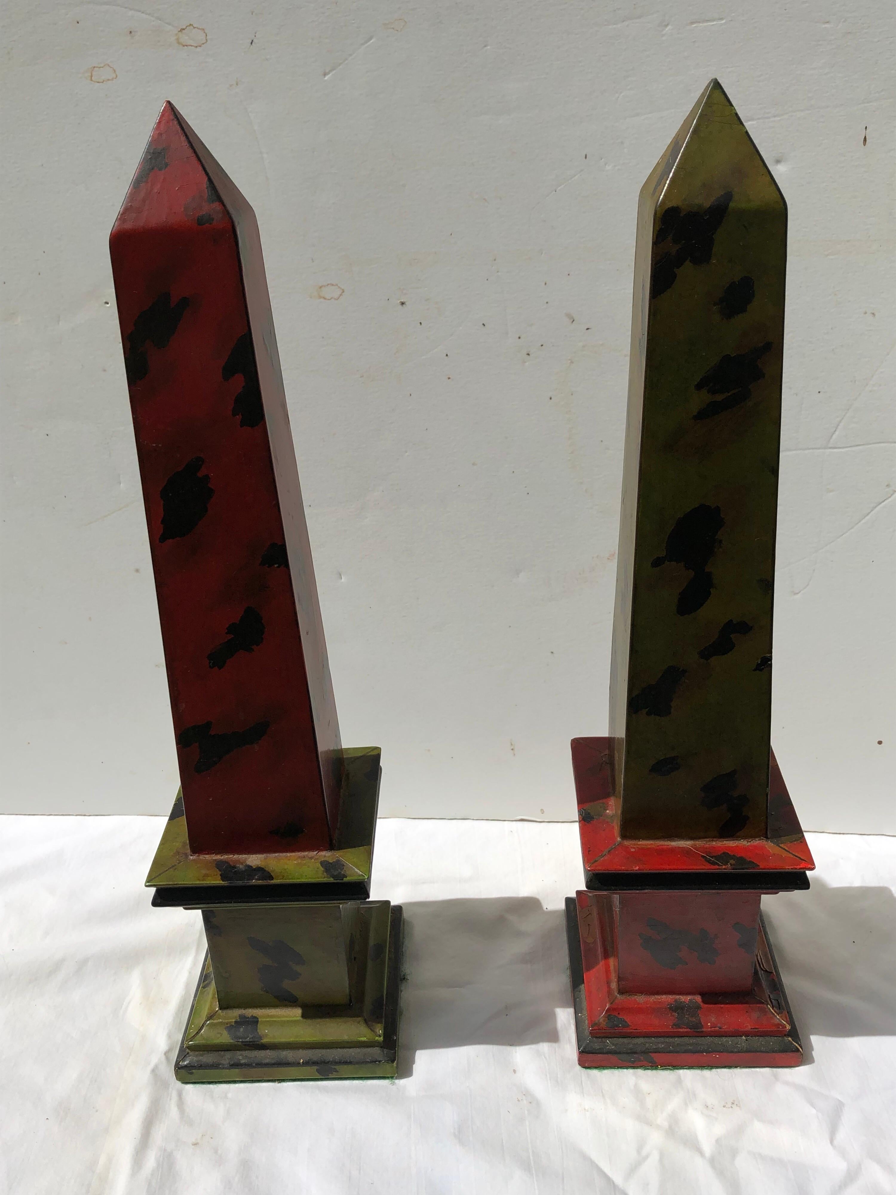 Pair of red and green faux tortoiseshell wooden hand painted obelisks. Finished with
green felt on the bottom sides to protect furniture. Painted in the Isabel O’Neil Studio
For the painted finish in NYC.