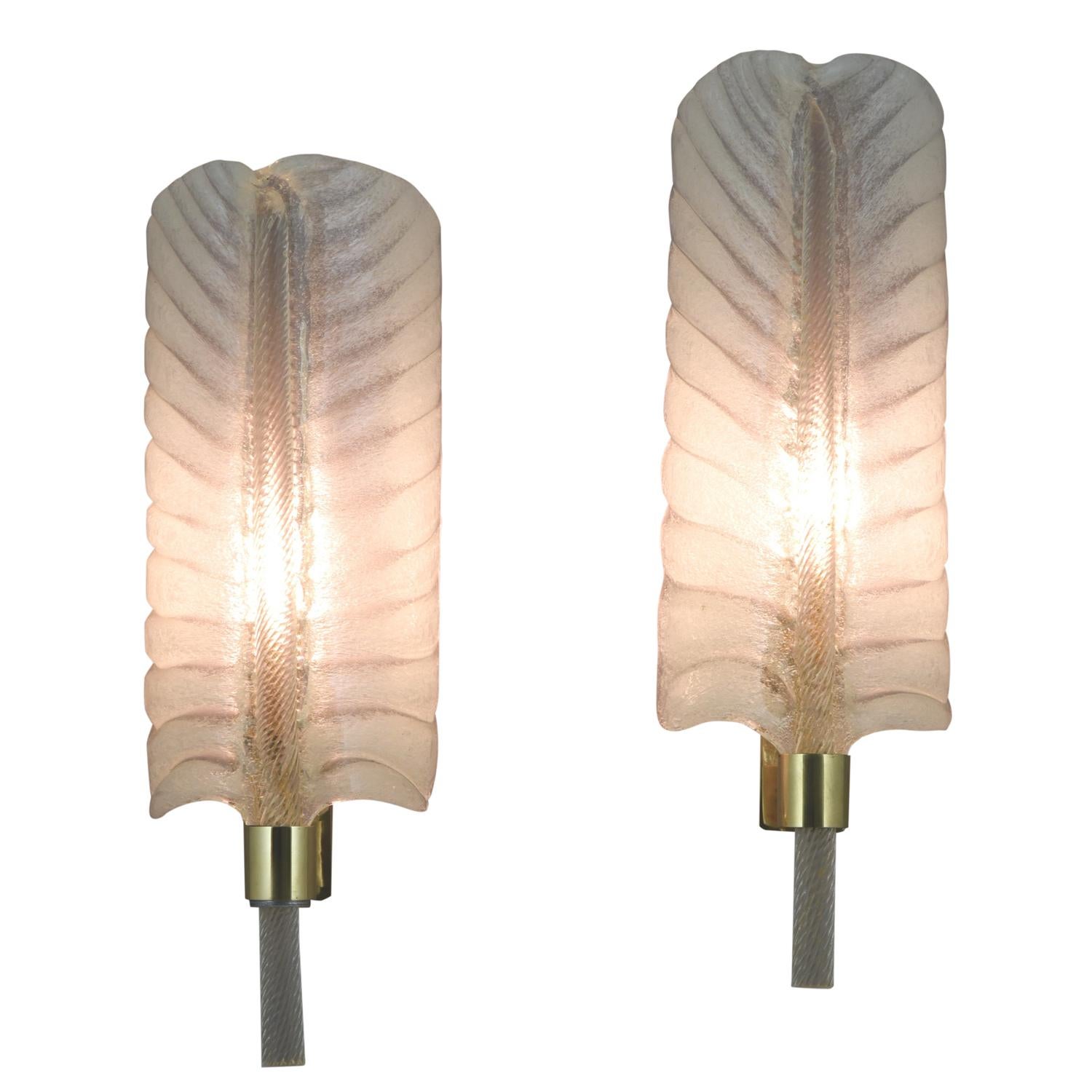 Large pair of midcentury feather shaped glass sconces.
This design is attributed to André Arbus 1903-1969 who designed lighting for Veronese between 1946 and 1952. 
These sconces were produced by Seguso Vetri d'Arte at Murano. 

Feather shaped
