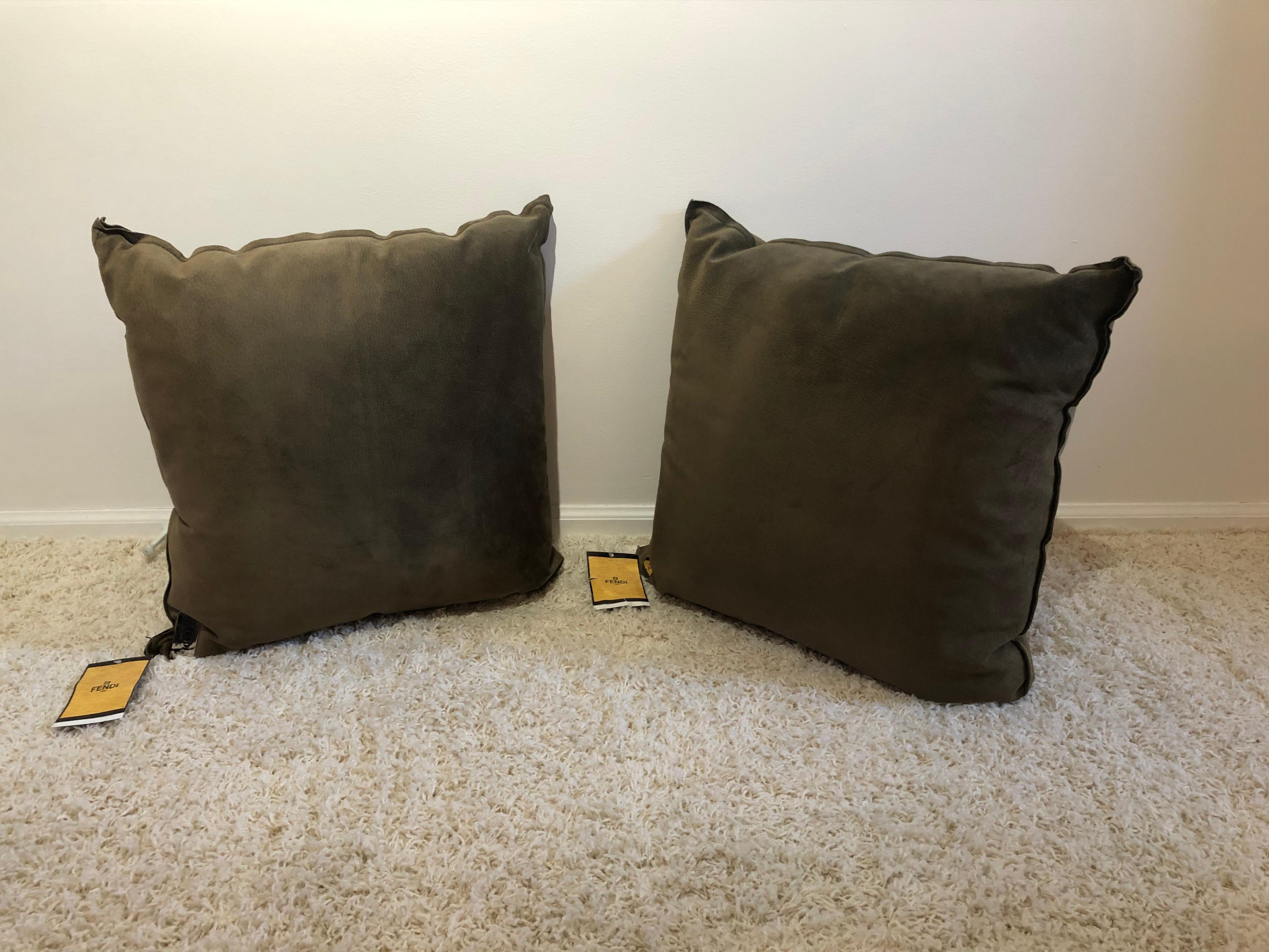 Pair of Fendi large Suede pillows with metal polished tags and original labels, suede is in very good original condition
Unused and a olive taupe color neutral. New old stock.