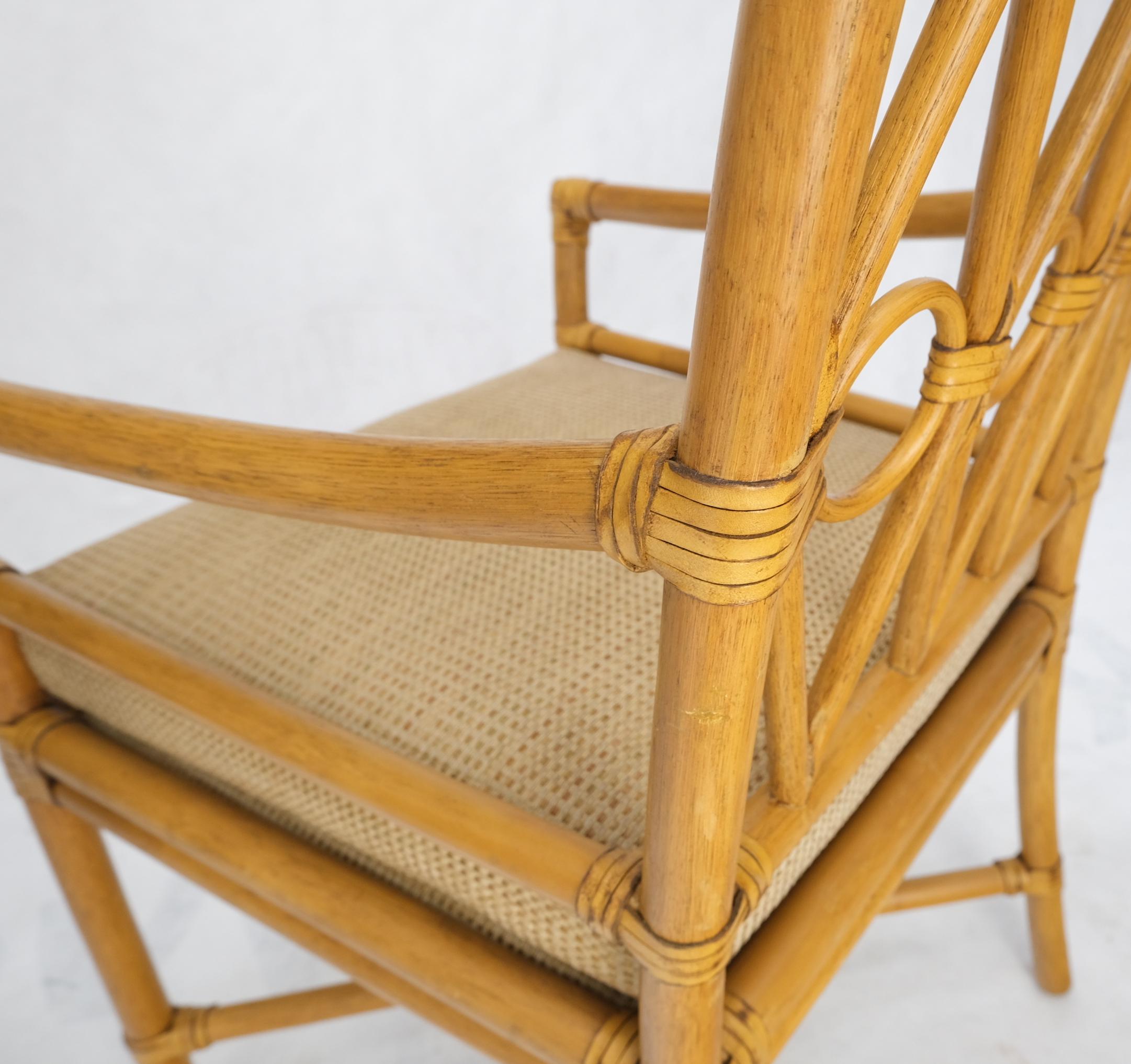 Pair Ficks Reed blonde rattan leather straps design armchairs side chairs, 1970's.