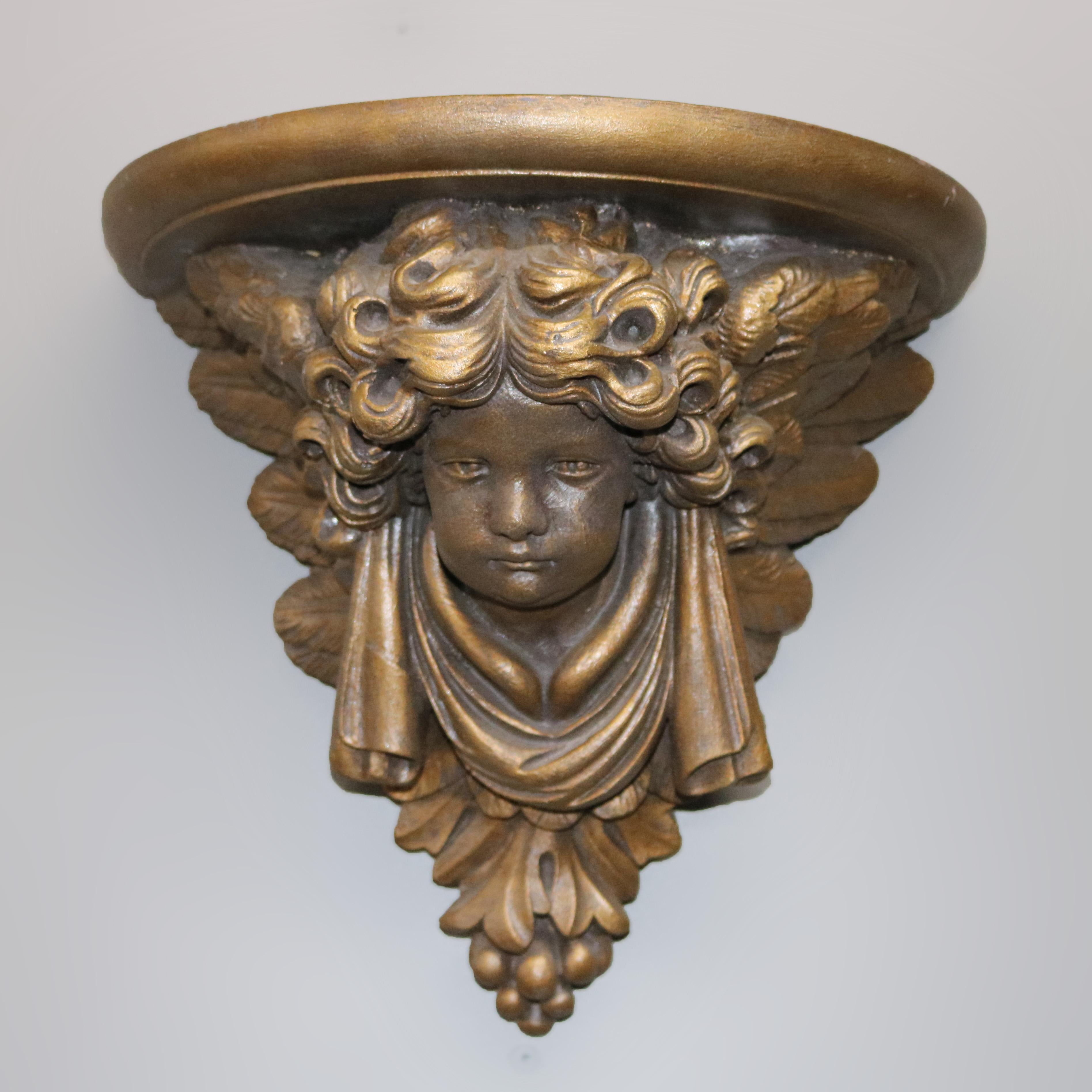 A pair of vintage figural composite wall shelves offer shelf over classical cherubs with foliate elements, 20th century

Measures: 12
