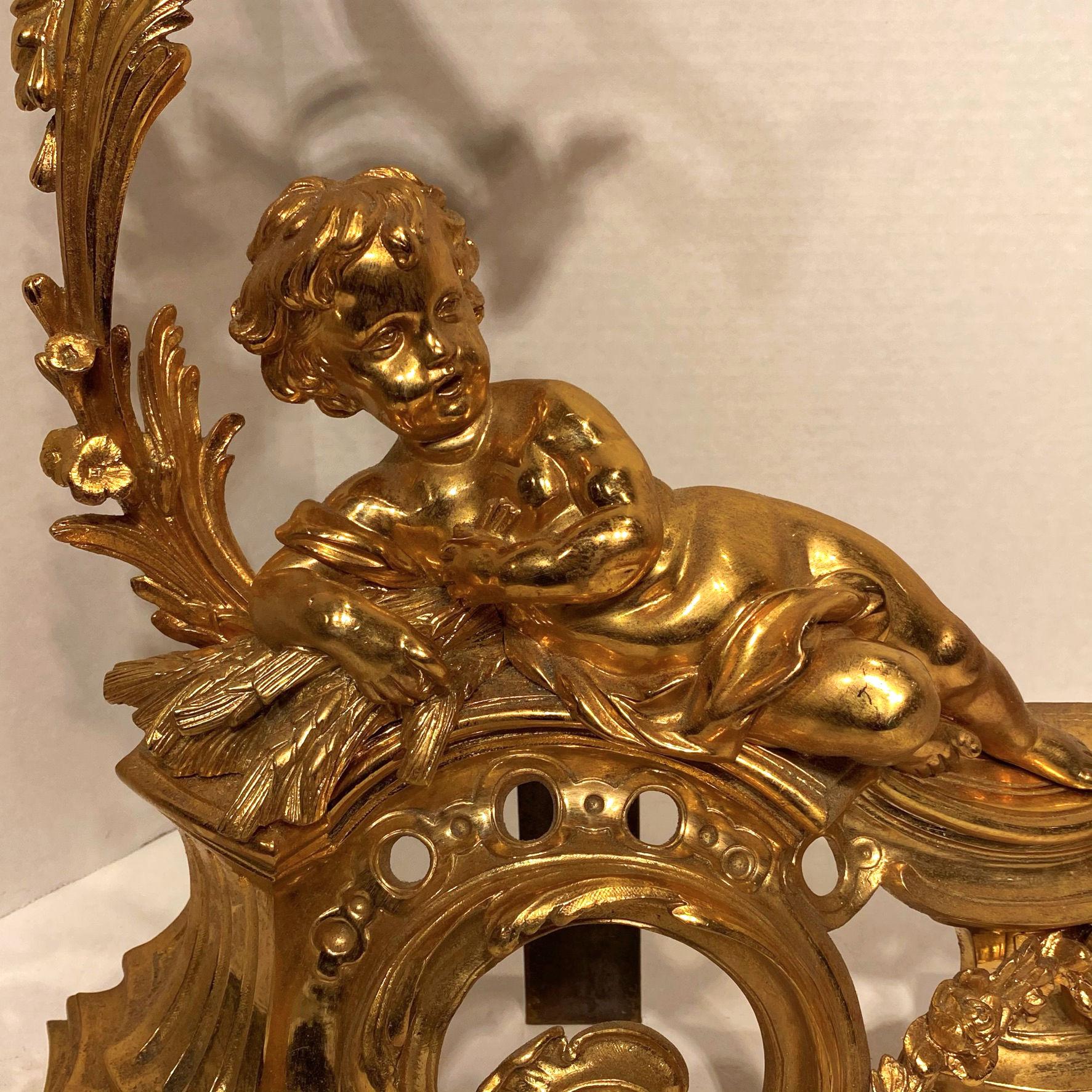 Gilt Pair of Figural Louis XV Style Cherub Motif Ormolu Bronze Andirons For Sale