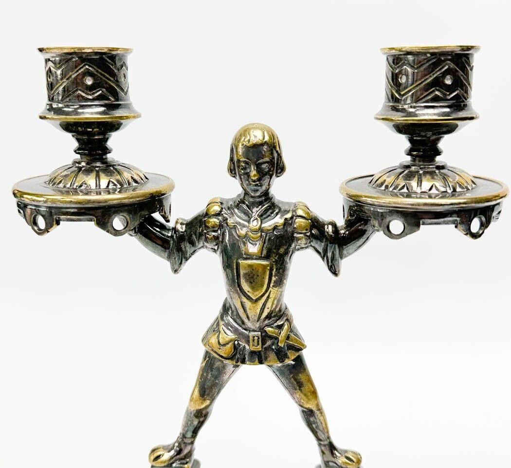  Pair silver plate figural candlestick holders, circa 1900. Candle stick holders in the form of squires supporting the bobeches. Underside marked 5118.

Additional Information: 
Type: Candlesticks
Materials: Silver Plate
Weight Approx., 7.5 lbs