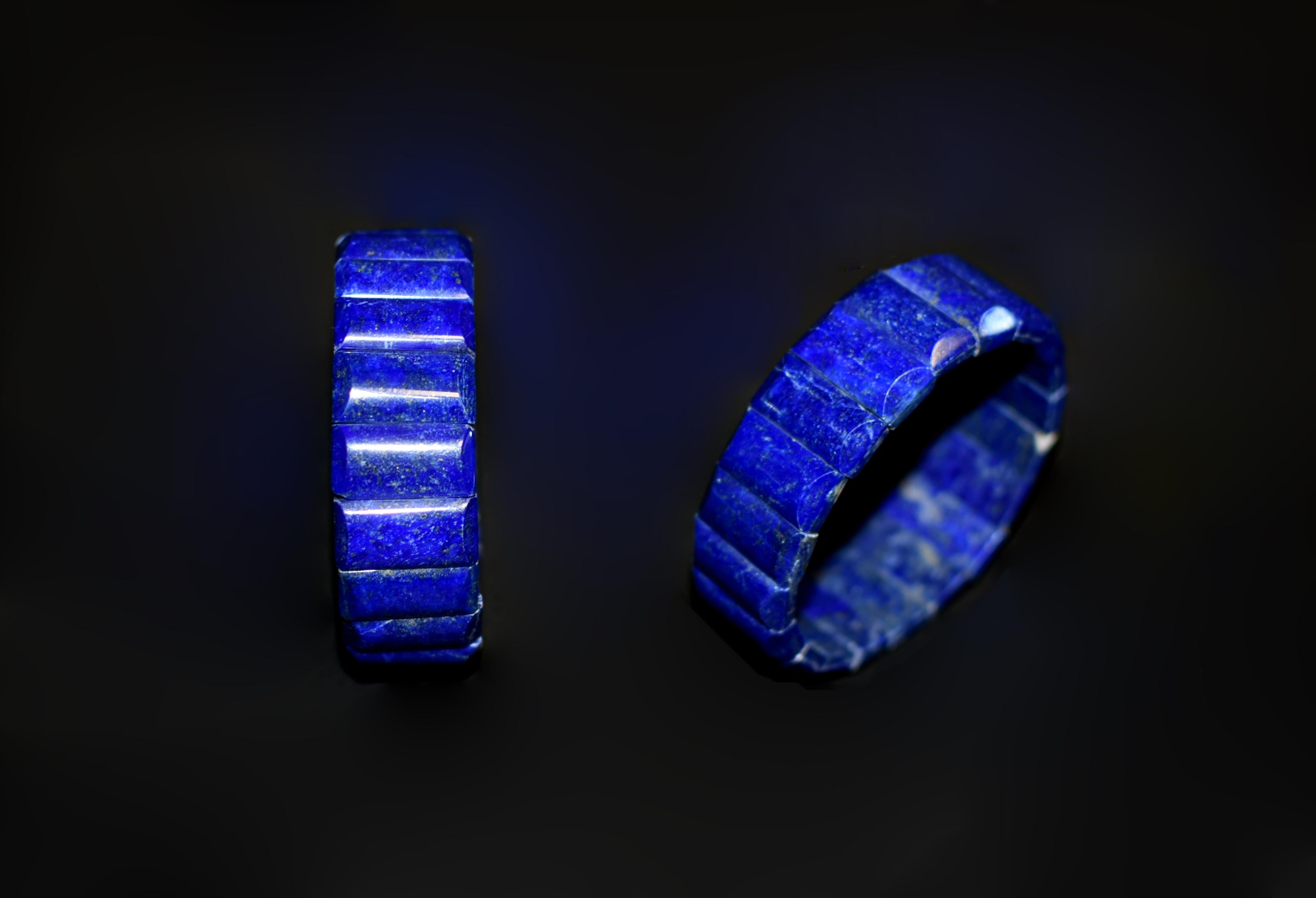 A pair of stunning bracelets crafted from 100% genuine lapis lazuli, showcasing the finest AAAA-grade quality, all natural and ethically sourced from the legendary mines of Afghanistan. Each piece is meticulously cut and hand-formed from undyed