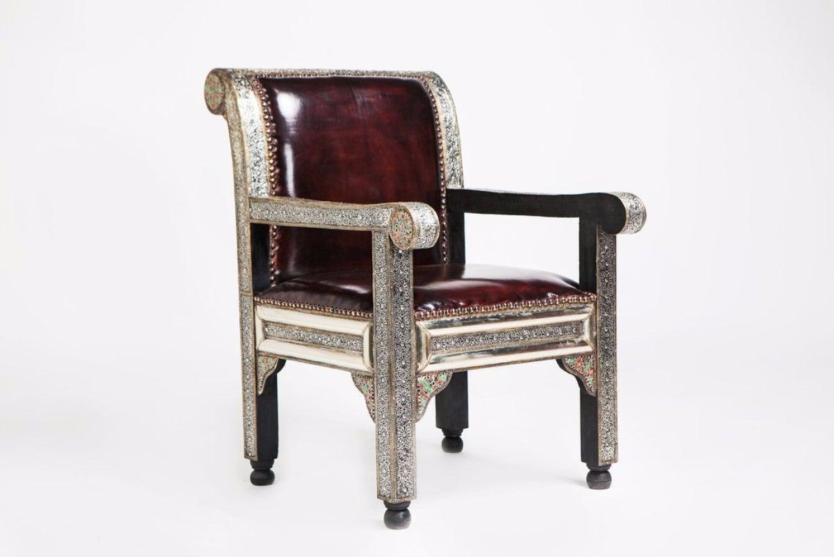 Fine Leather Hollywood Regency Armchairs / Bergere Chair, a Pair 
Glamorous Hollywood Regency style handcrafted details define this incredible pair which consists of two 100% fine leather and white brass decorated with colorful natural stone. This
