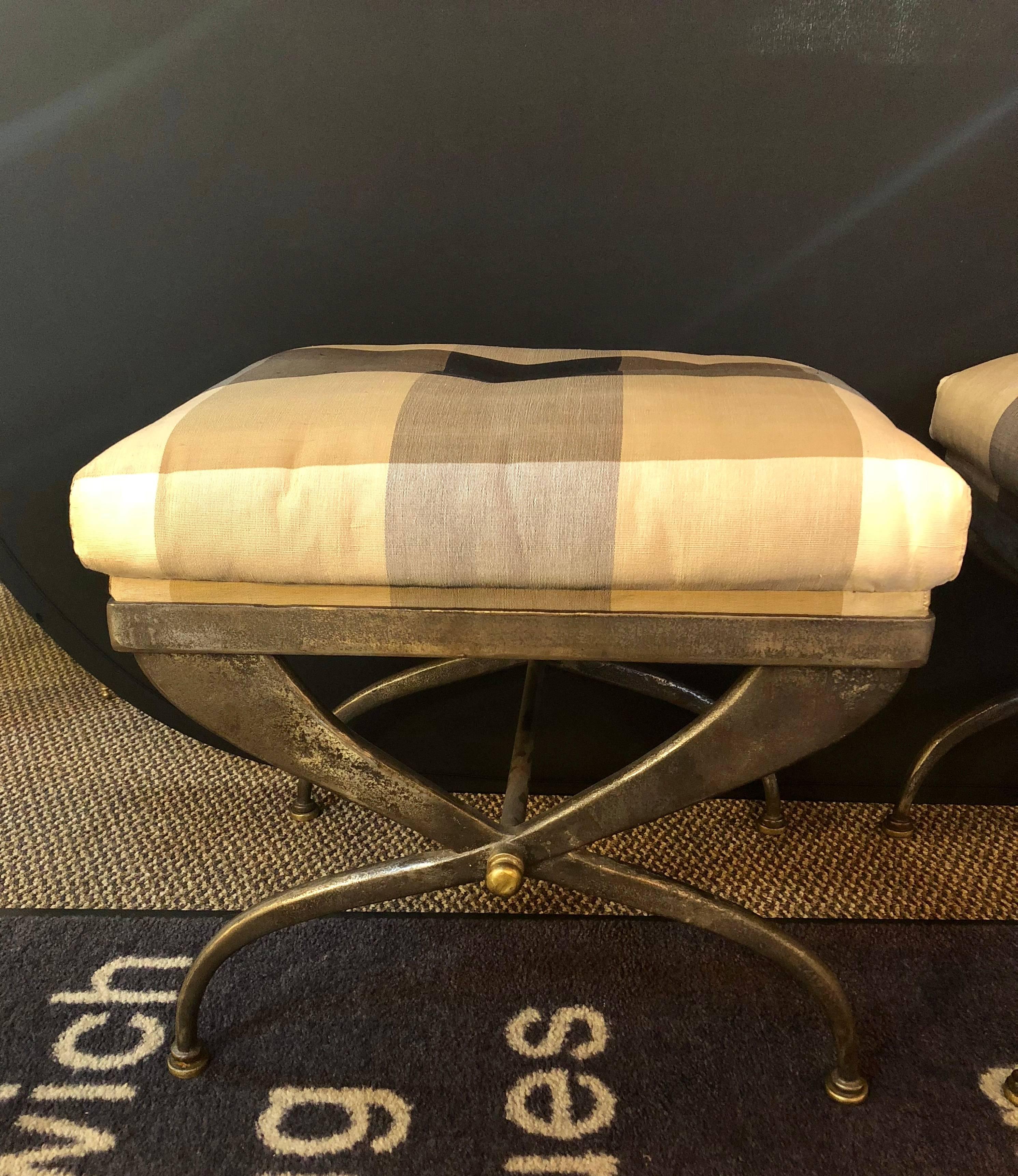 A very fine pair of Maison Jansen footstools or benches having an X-Design steel and bronze-mounted frame. A fantastic and heavy pair of solid steel and bronze mounted benches. Each having a Burberry style fabric that has a fitted wood base to sit