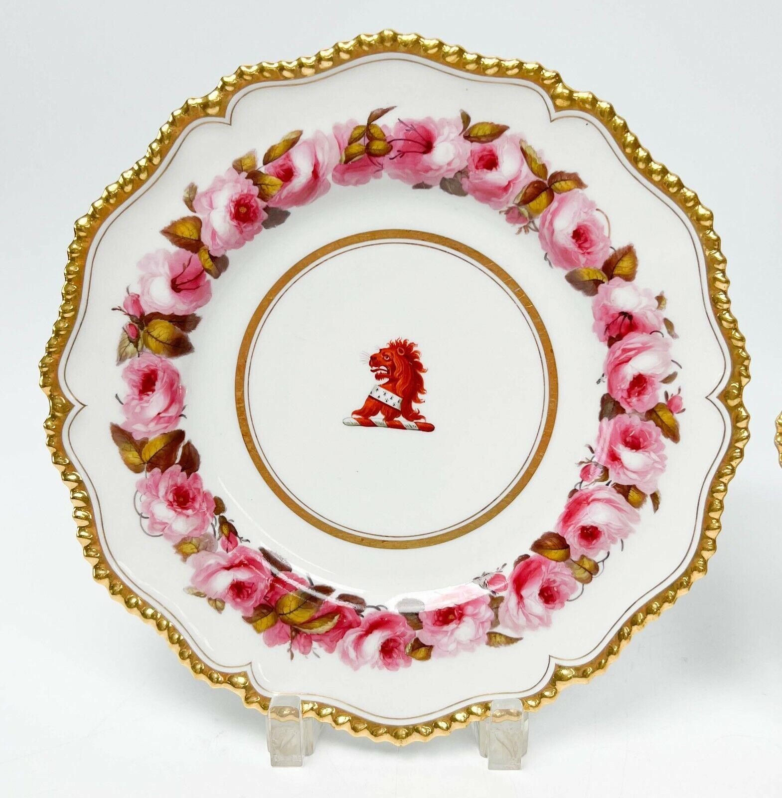 Pair Flight, Barr & Barr Worcester hand painted porcelain armorial dinner plates, circa 1813-19. 

Red armorial lion to center with a pink rose pattern to edge. Gilt band to the center and gilt to the scalloped rim. Flight Barr & Barr Worcester