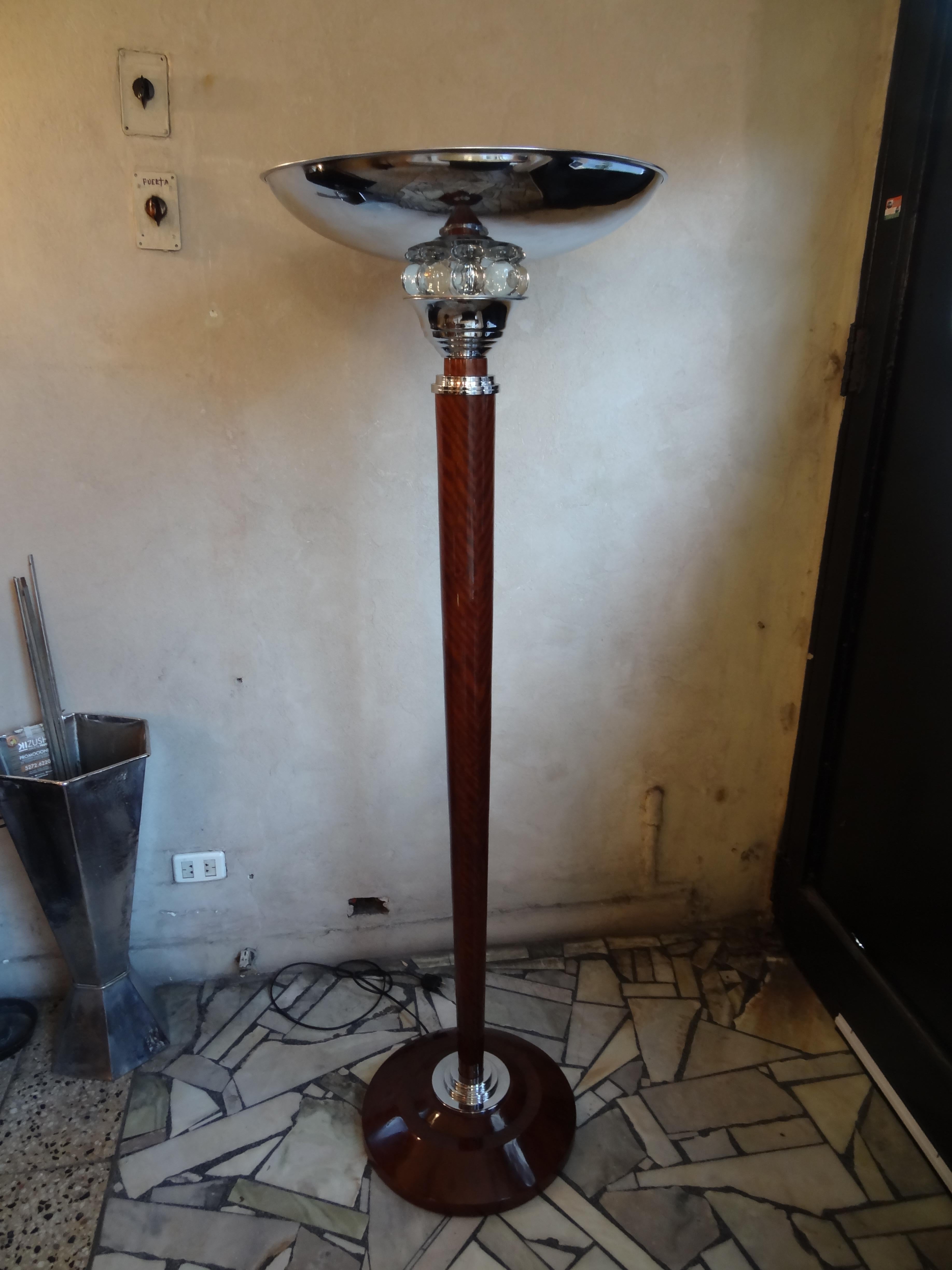 2 floor lamps Art Deco

Materials: wood, glass, chrome
France
You want to live in the golden years, those are the floor lamps that your project needs.
We have specialized in the sale of Art Deco and Art Nouveau styles since 1982. 
Pushing the