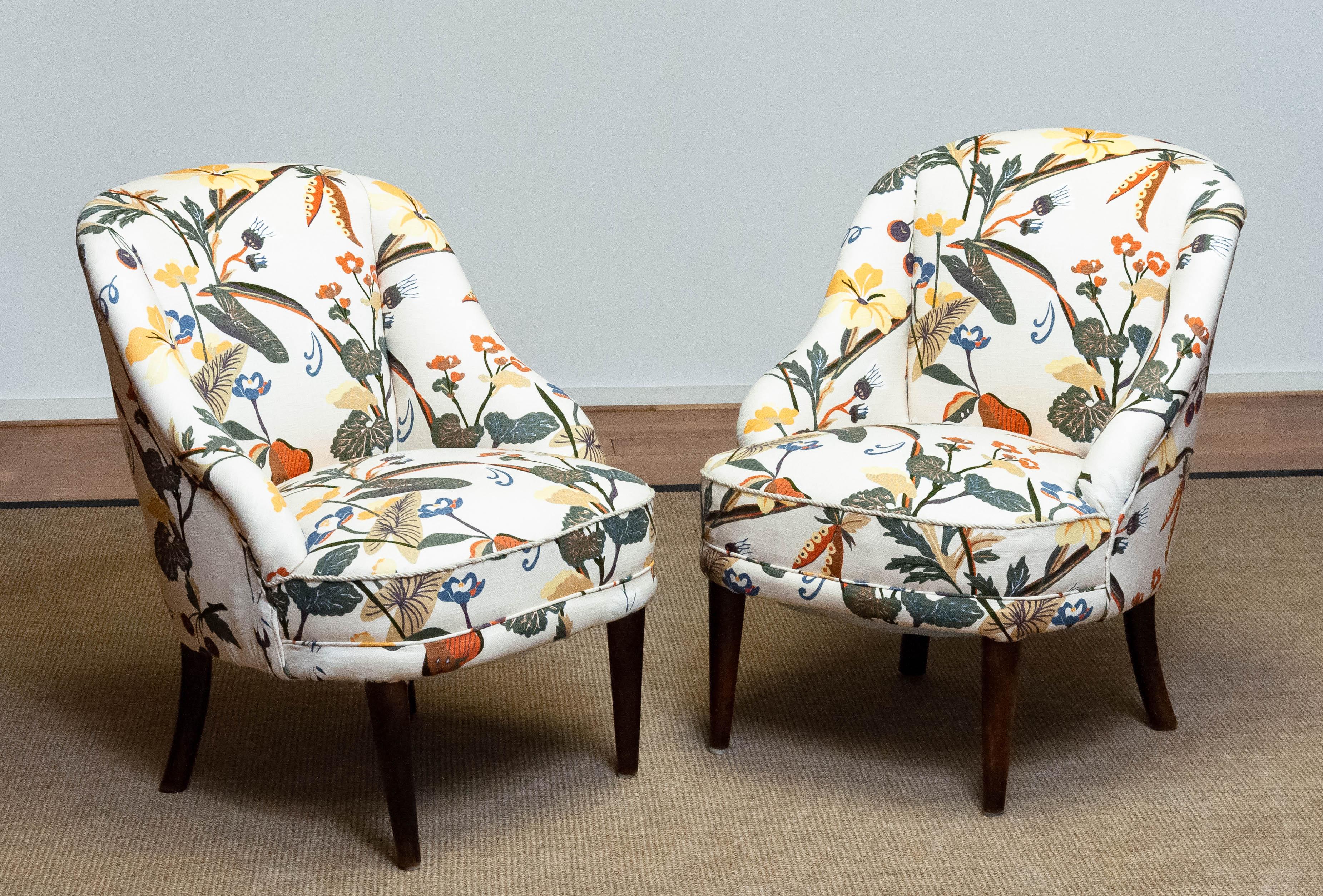Beautiful pair Danish slipper chairs from the 1940s both new upholstered with floral printed linen similar to the famous and bright Josef Frank fabrics. Frame and legs are made of beech and both in good condition. Hand-tied springs and webbing are