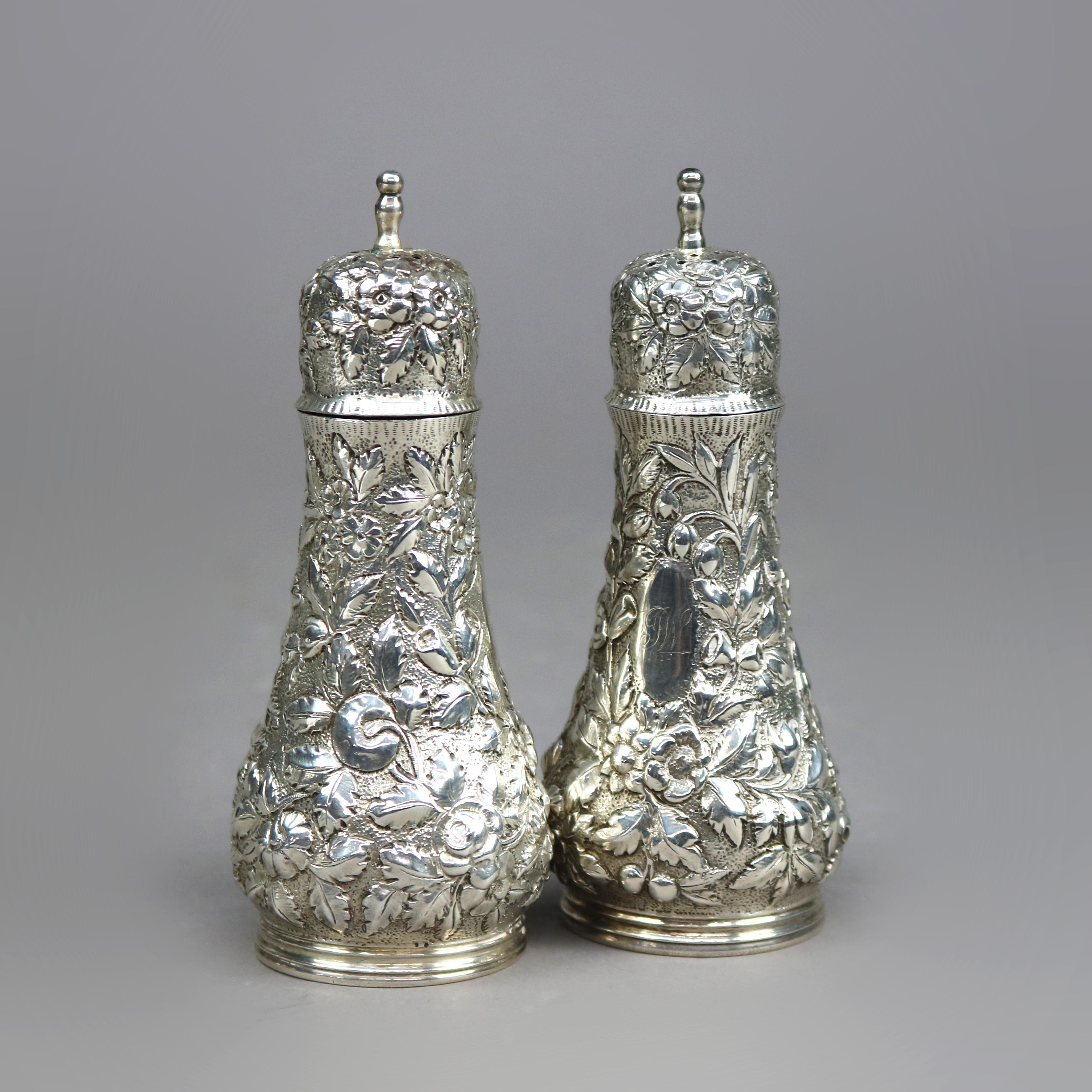 An antique pair of salt and pepper shakers by S. Kirk and Sons offer sterling silver floral repousse construction, maker mark on base as photographed, c1890

Measures - 5.25''H x 2''W x 2''D.