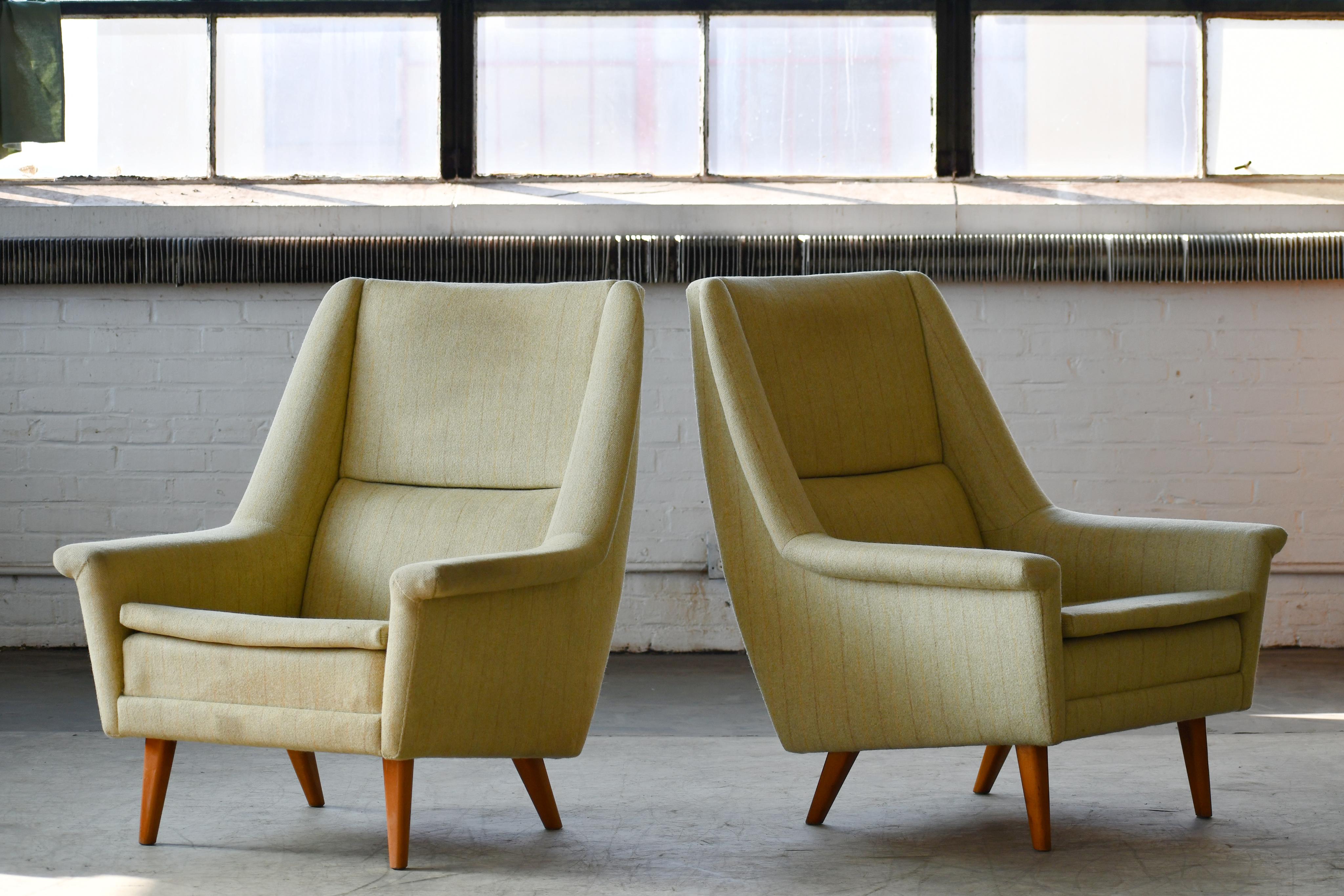 Classic and very elegant pair of lounge chairs designed by Folke Ohlsson circa 1955 for Fritz Hansen. We love the elegant angles of the chairs and the legs combined the slim cushions. Very cutting edge in their day and just very timeless modern
