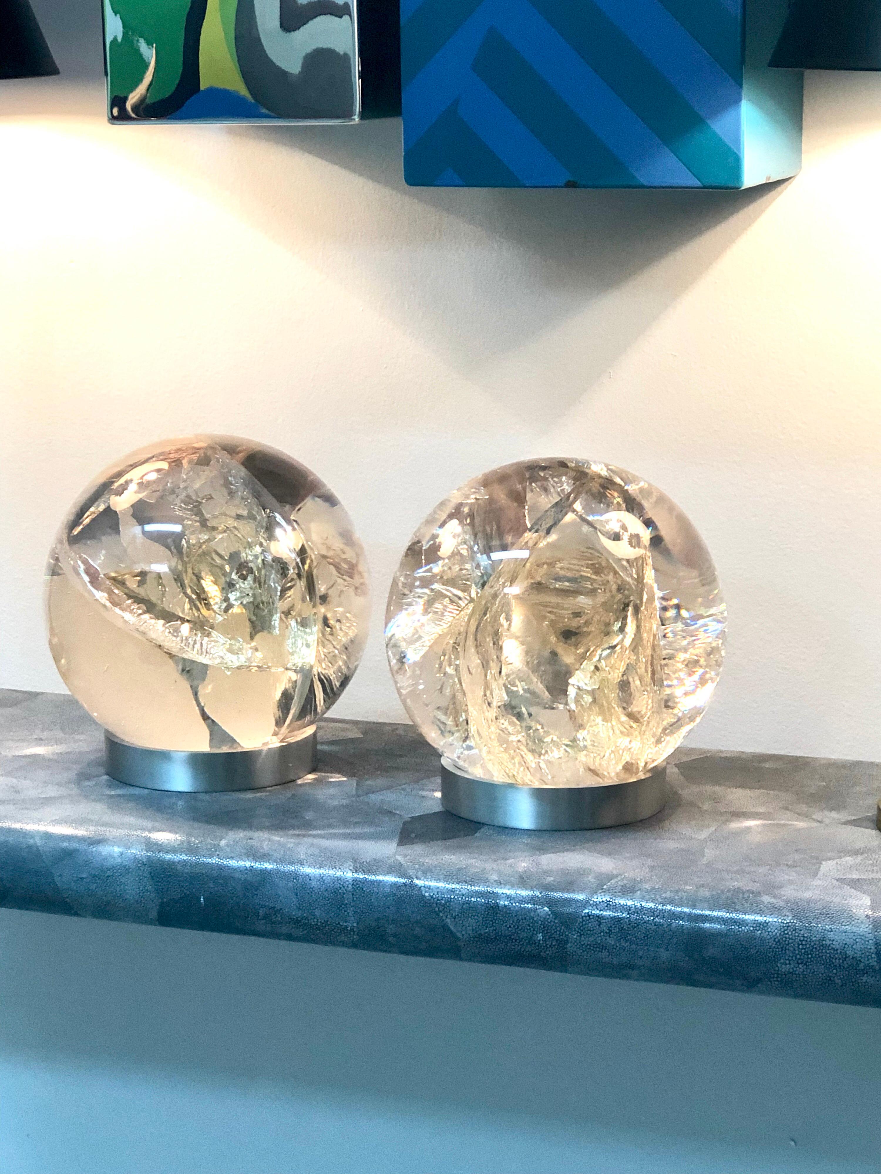 A pair of large vintage French Fractal Resin orbs on metal bases.