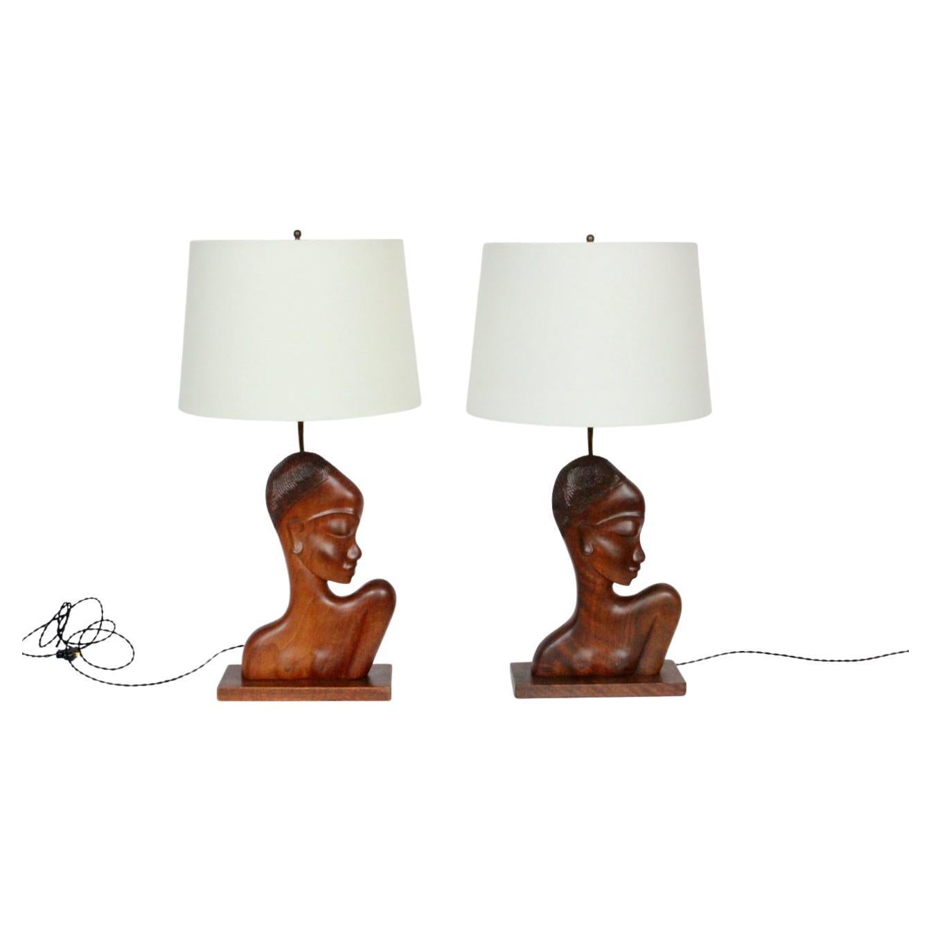 Pair of carved mahogany female Nubian Bust table lamps by Franz Hagenauer. Featuring handcrafted smooth solid Mahogany figural Negress sculptural figures with highly formalized features in low relief, a top rectangular Mahogany (4.5D x 10.75W)