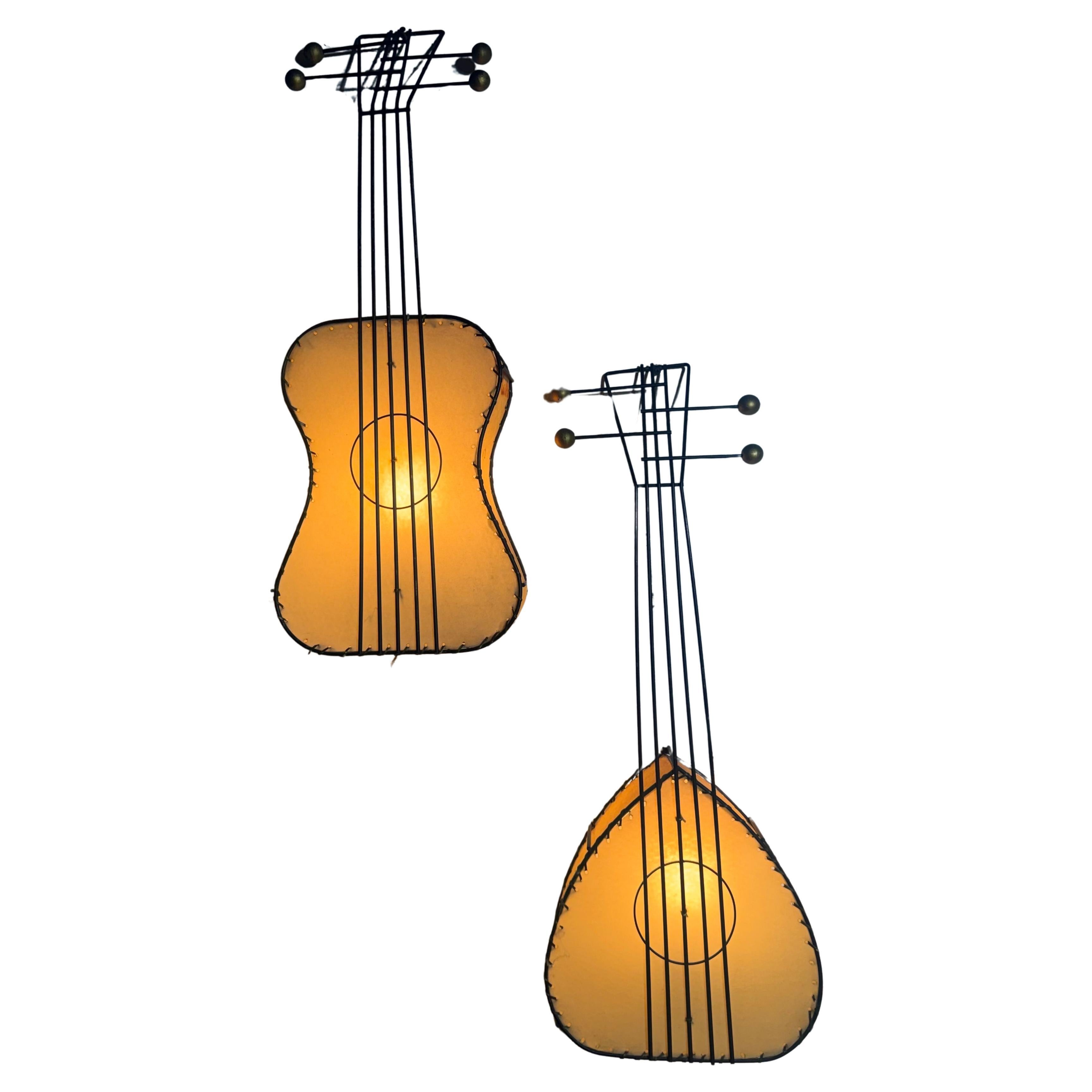 Pair Frederick Weinberg Black Wire Framed 
Parchment "Guitar" Wall Lights in vendita