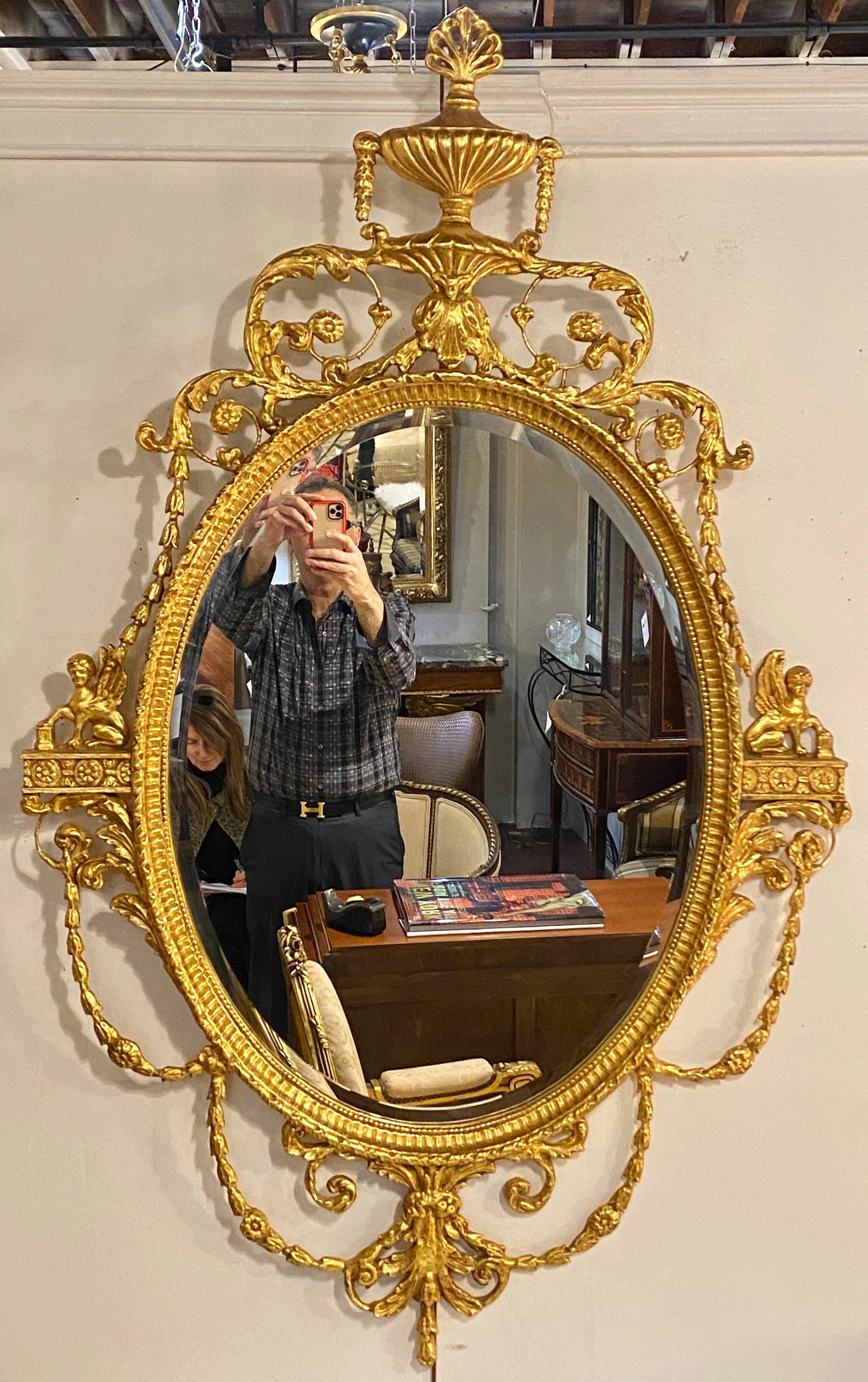 Pair of Freidman Brothers compatible sphinx gilt gold beveled oval wall mirrors. One is slightly brighter than the other not noticeable when spread apart. Can purchase only one if only one is required.
1/ES.