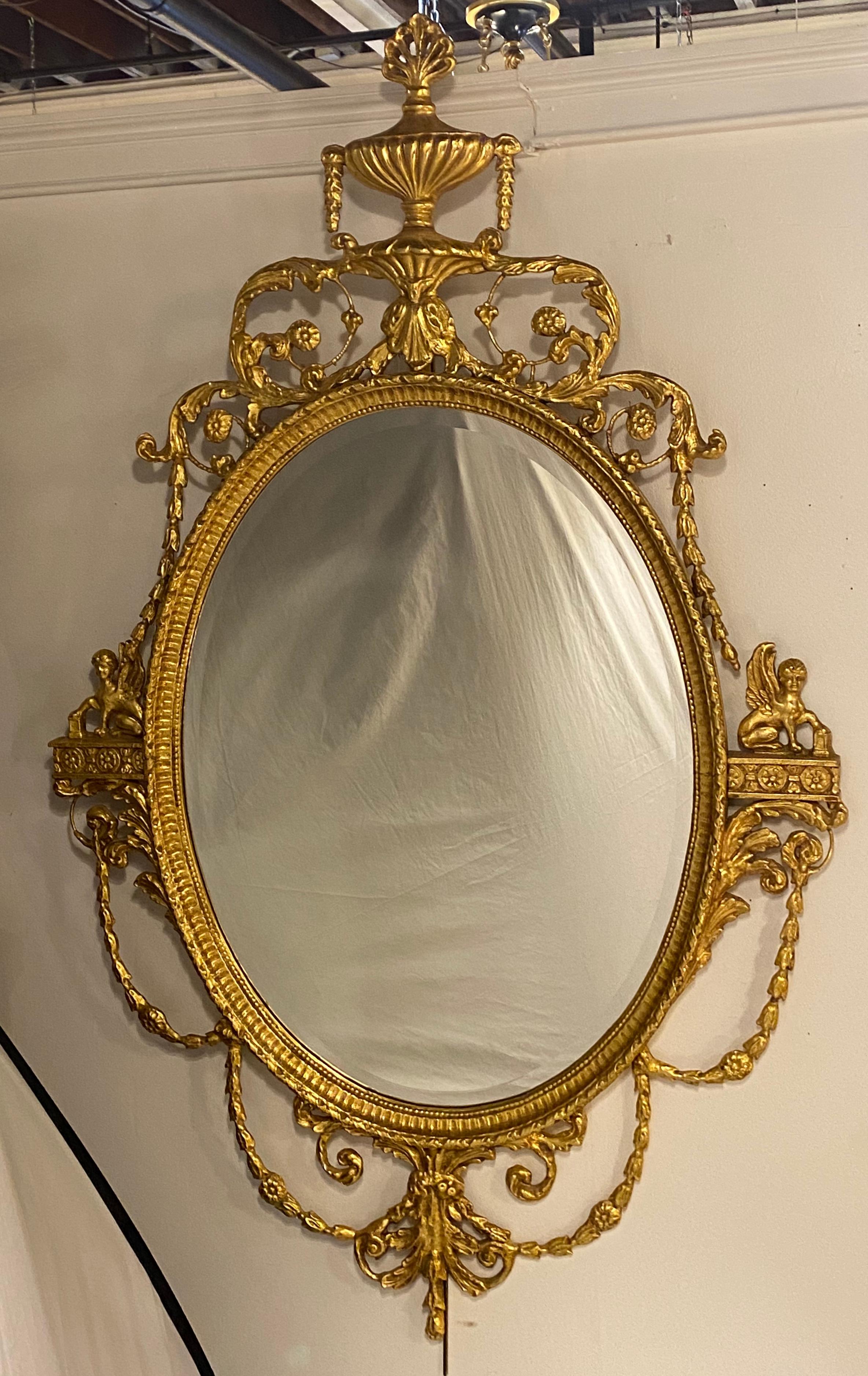 Pair of Freidman Brothers Compatible Sphinx Gilt Gold Beveled Oval Wall Mirrors In Good Condition In Stamford, CT