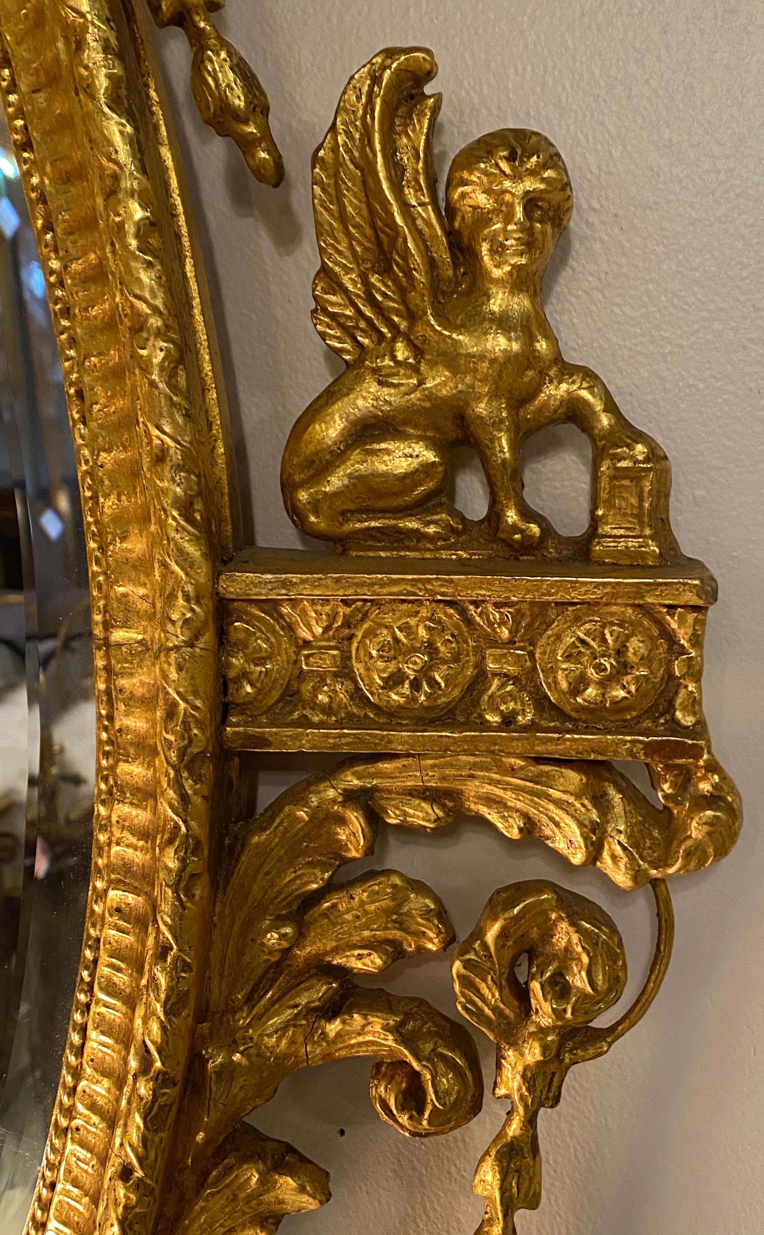 20th Century Pair of Freidman Brothers Compatible Sphinx Gilt Gold Beveled Oval Wall Mirrors