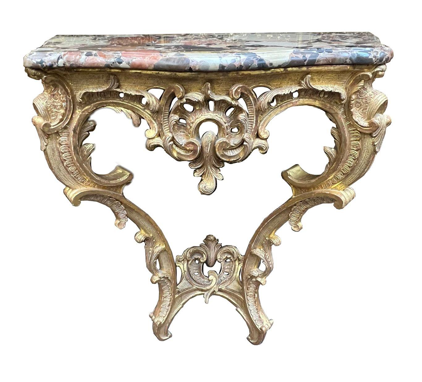 A good quality pair of late 18th Century French carved gilt wood console tables, each with their original Breccia marble tops. Scrolling foliate and pierced decoration to the frieze cabriole supports which is united by a stretcher below.
 
Batch 73