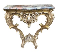 Pair French 18th Century carved gilt wood console tables.