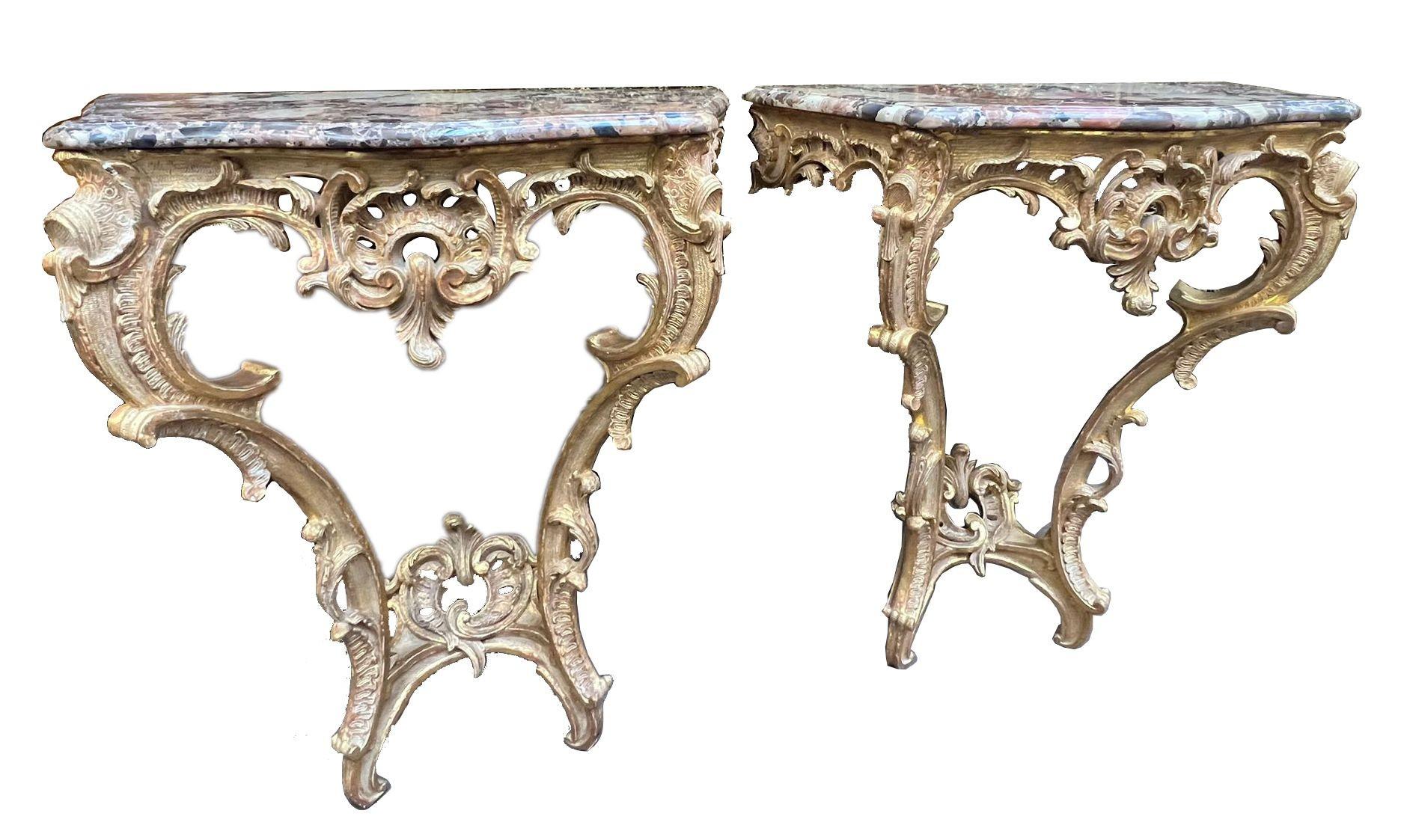 Hand-Carved Pair French 18th Century carved gilt wood console tables. For Sale