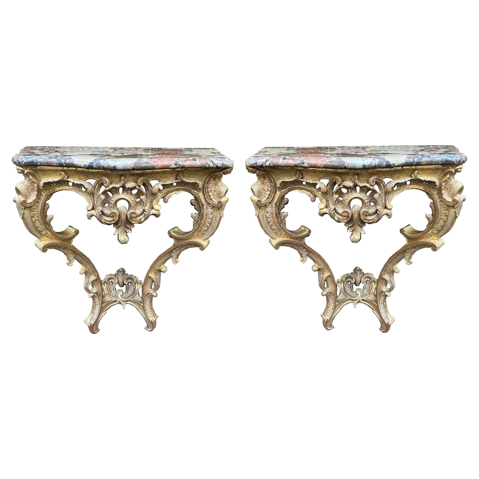 Pair French 18th Century carved gilt wood console tables. For Sale