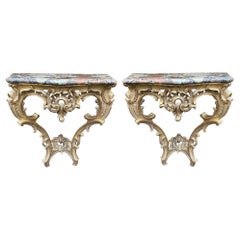Antique Pair French 18th Century carved gilt wood console tables.