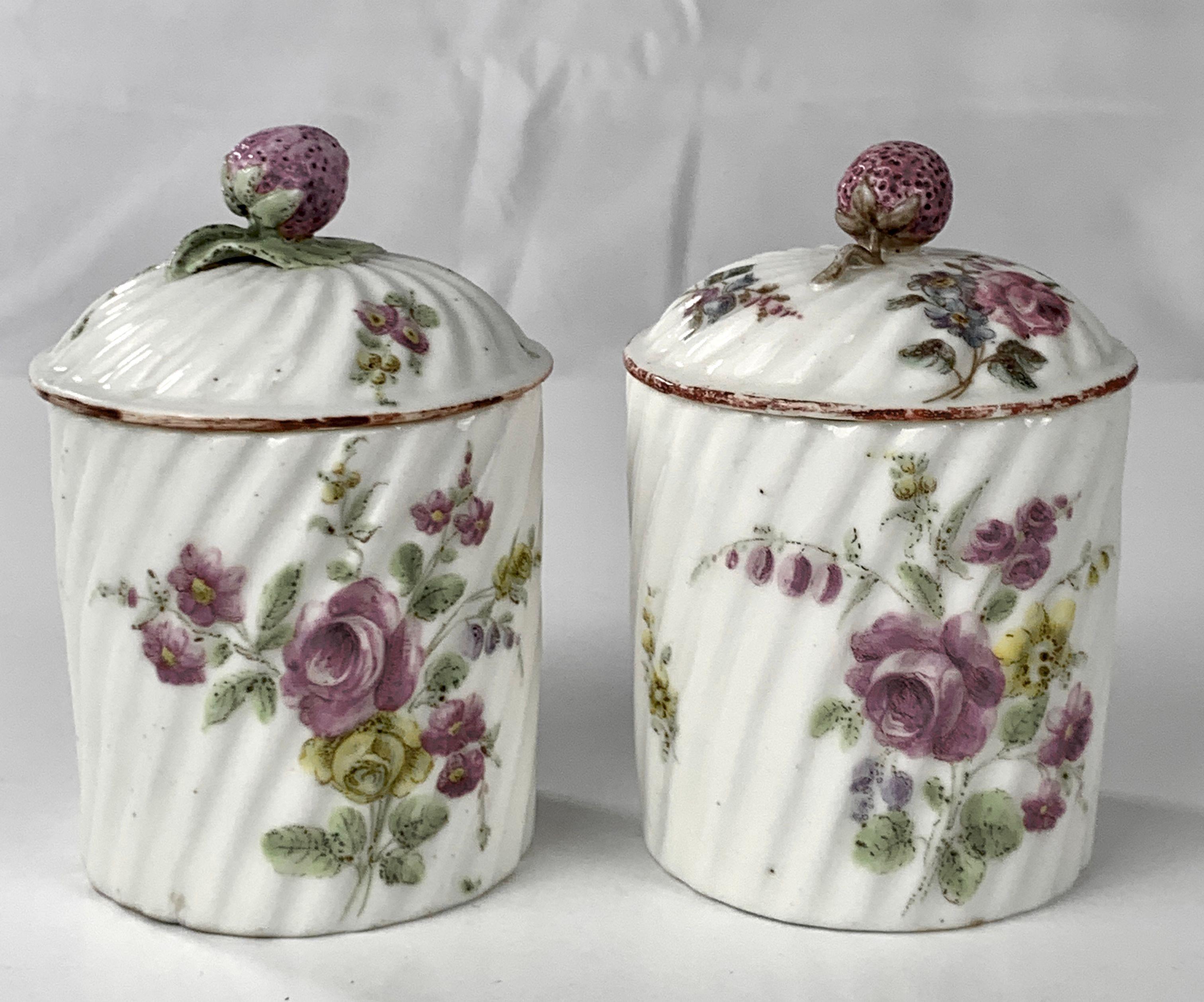 These beautiful Mennecy porcelain soft-paste pomade jars were hand-painted in the 18th century, circa 1765. They are rare. 
Jars like this would have been placed on the vanity of an aristocratic lady.
Both the body and the cover have lovely spiral