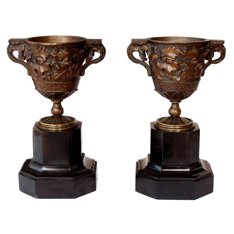 Pair French 19th C.  Bronze Decoartive Urns on Marble Bases