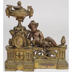 Paire de chenets de style Louis XV du 19ème siècle en bronze doré avec putti